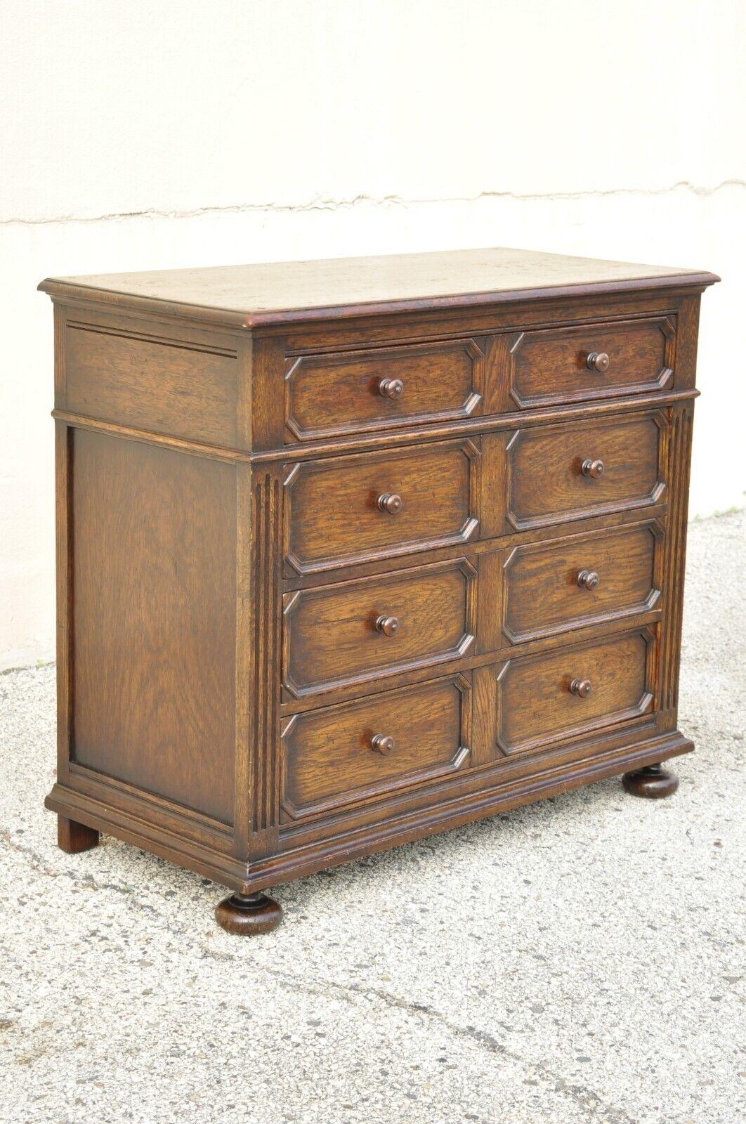 Antique Oak Jacobean style carved wood chest of drawers low chest dresser. Item features bun feet, solid wood construction, beautiful wood grain, distressed finish, 4 dovetailed drawers, very nice antique item, great style and form, matching dresser