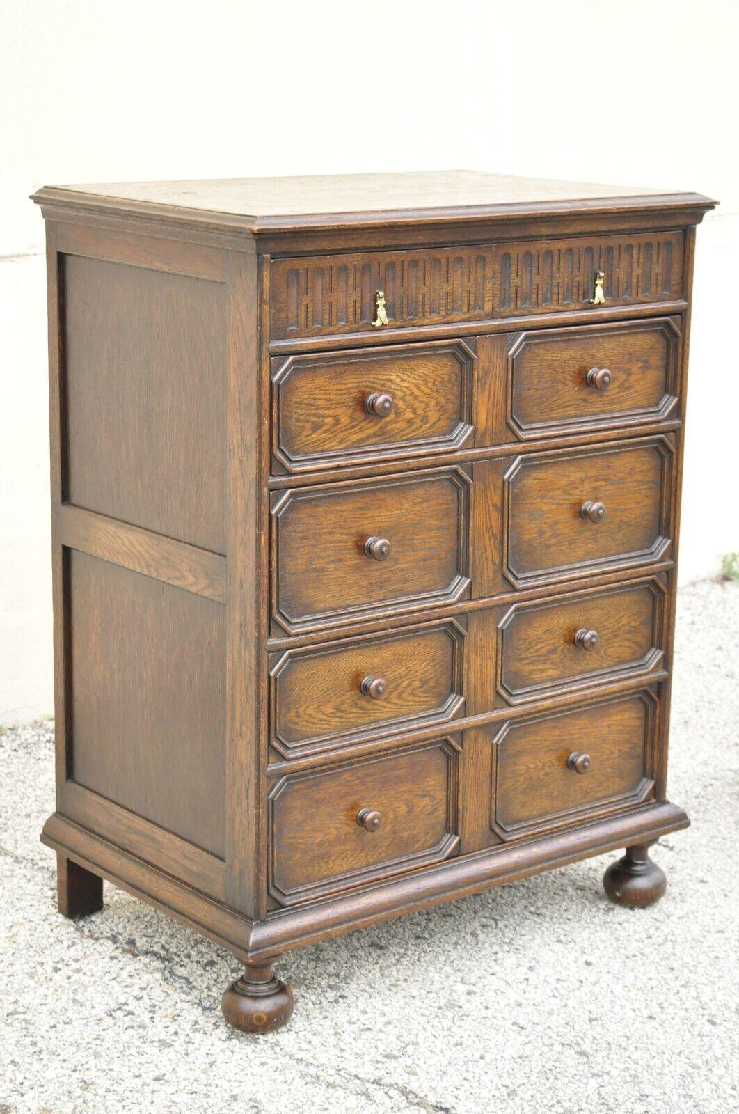 Antique Oak Jacobean Style Carved Wood Chest of Drawers Tall Chest Dresser. Item features bun feet, solid wood construction, beautiful wood grain, distressed finish, 6 dovetailed drawers, very nice antique item, great style and form, matching