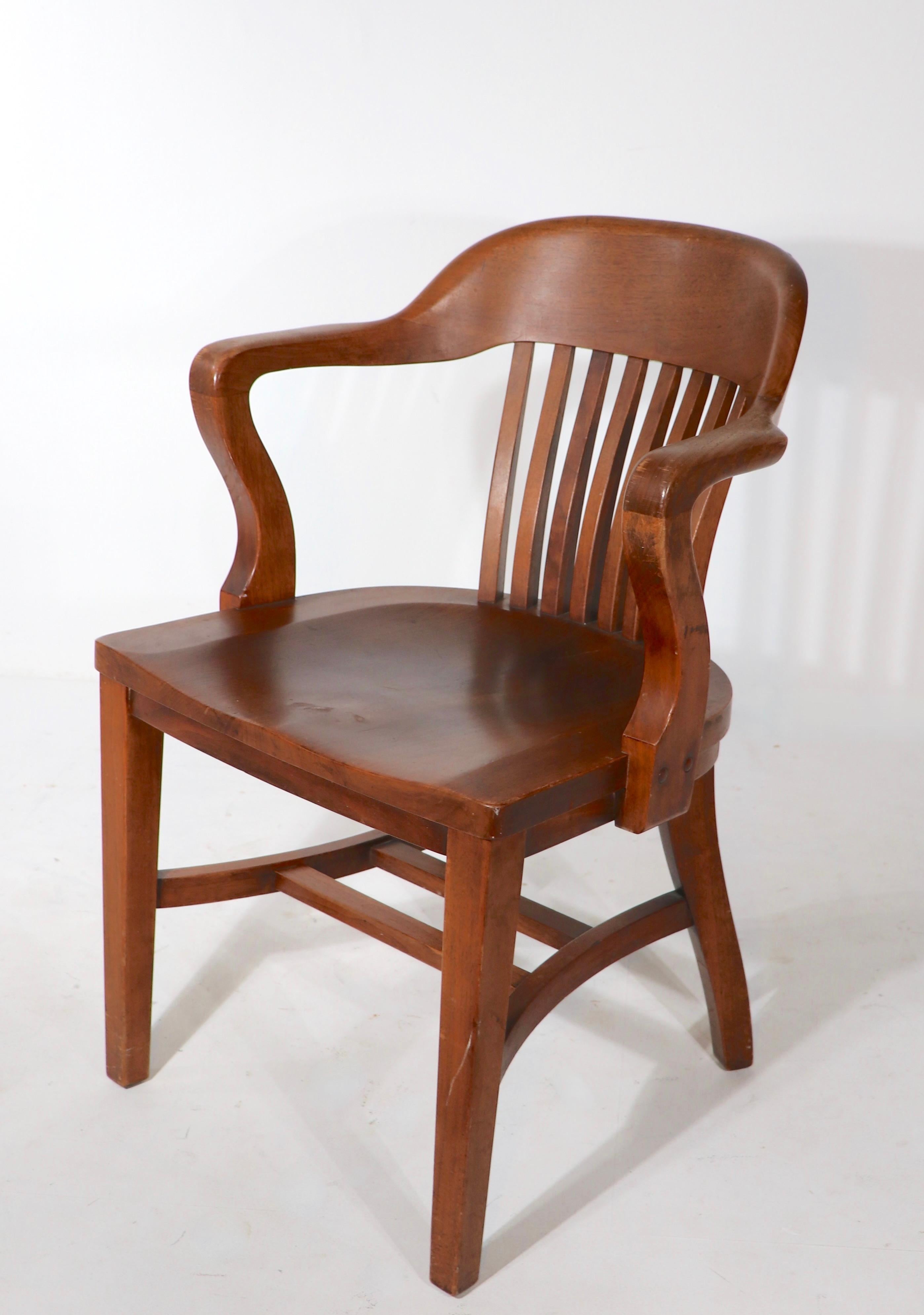 Iconic Yale Library, bank or England, Jury chair, attributed to Gunlocke, in solid oak. This example is in very good, original condition, clean and ready to use. 
 Measures: Total H 32 x Arm H 27.5 x Seat H 18 x 23 x D 18.75 inches.