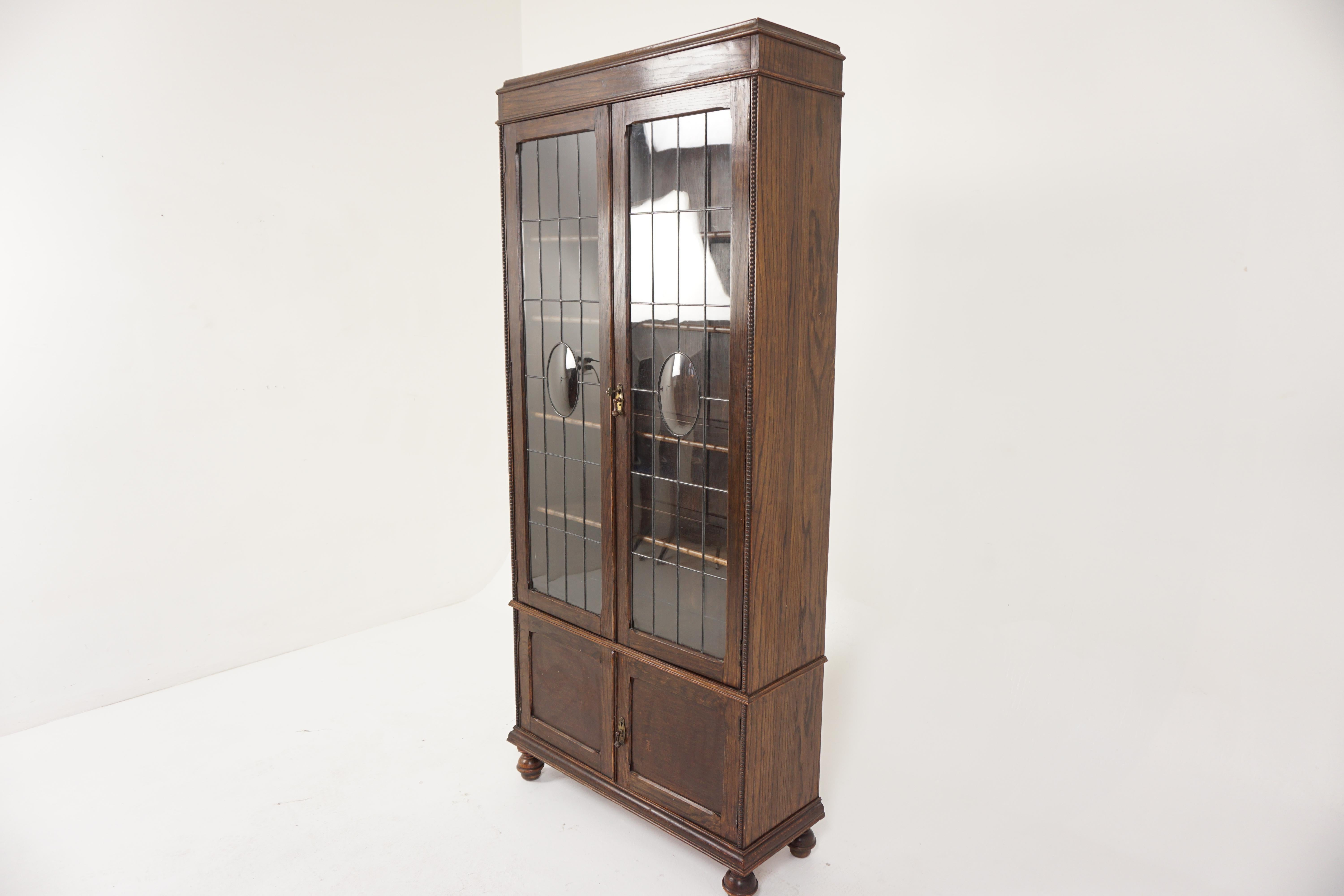 Antique oak leaded glass bookcase, display cabinet, Scotland 1910, B2941

Scotland 1910
Solid oak
Original finish
Moulded cornice on top
Pair of leaded glass doors
Original lock and key
Three graduating wooden shelves
Beading on the