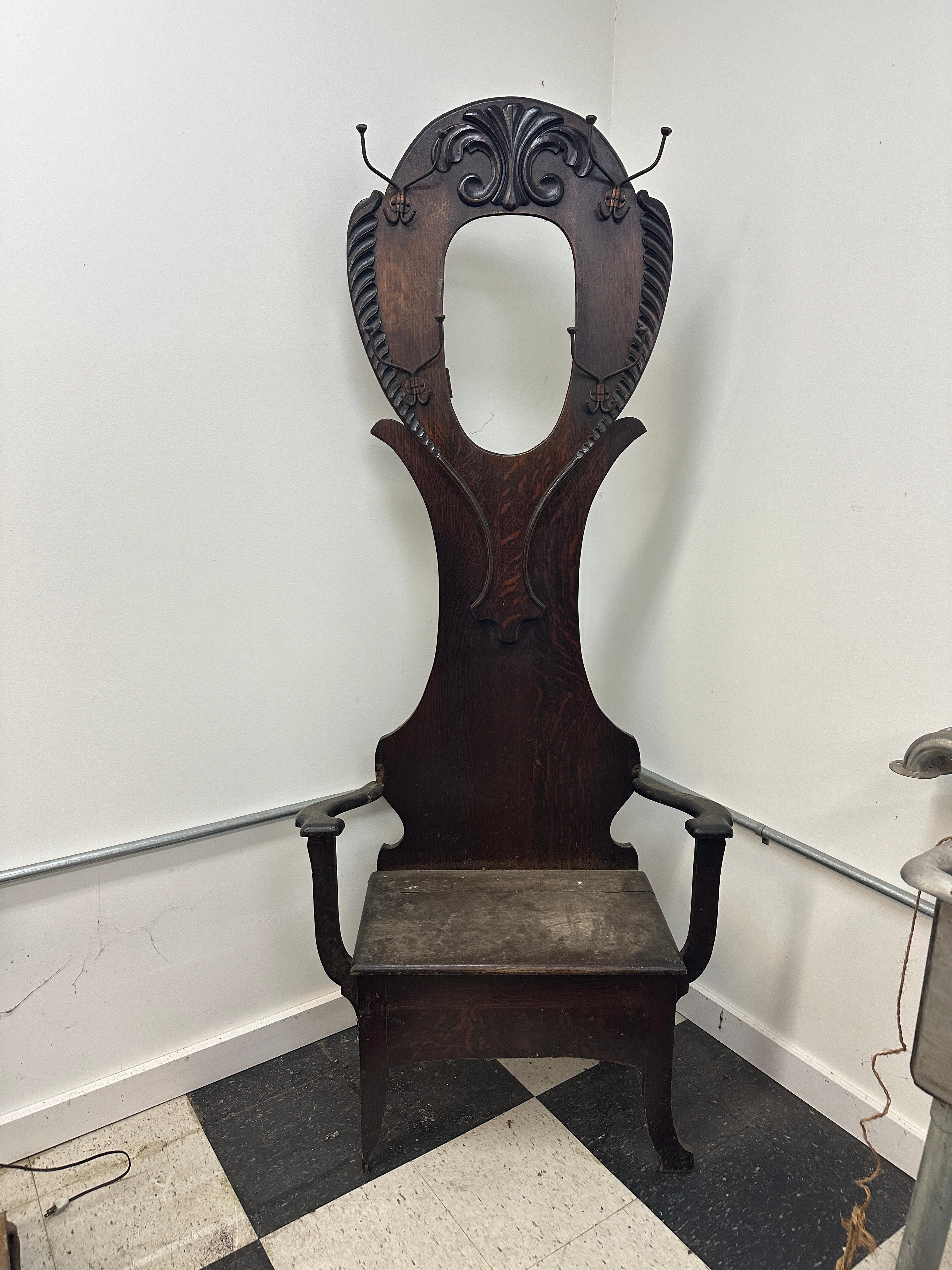 This is a beautiful Arts and Crafts Oak Hall seat. This piece shows minor wear with a break to each arm. Otherwise, this work presents well. Mirror included.