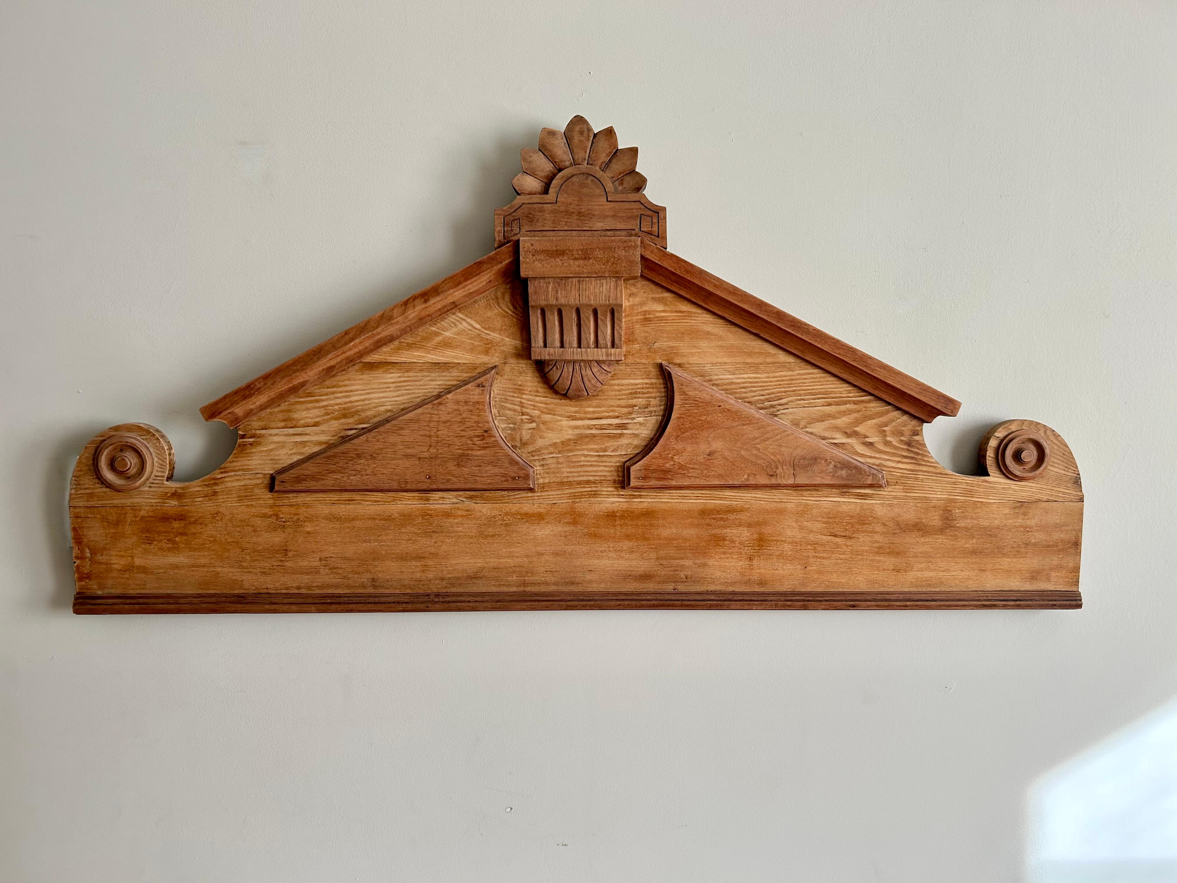 Wonderful antique pediment. Solid oak, probably late nineteenth century.
This piece has been professionally cleaned/ stripped of old paint and then oiled. It is in wonderful condition and ready to hang. We believe it to have several characteristics