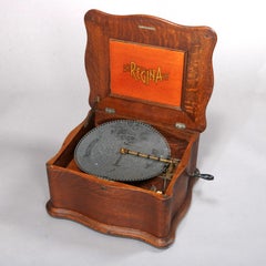 Antique Oak Regina Double Comb Disc Music Box Player with Ten Discs, circa 1890