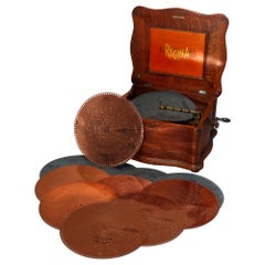Antique Oak Regina Double Comb Disc Music Box Player with Ten Discs, circa 1890