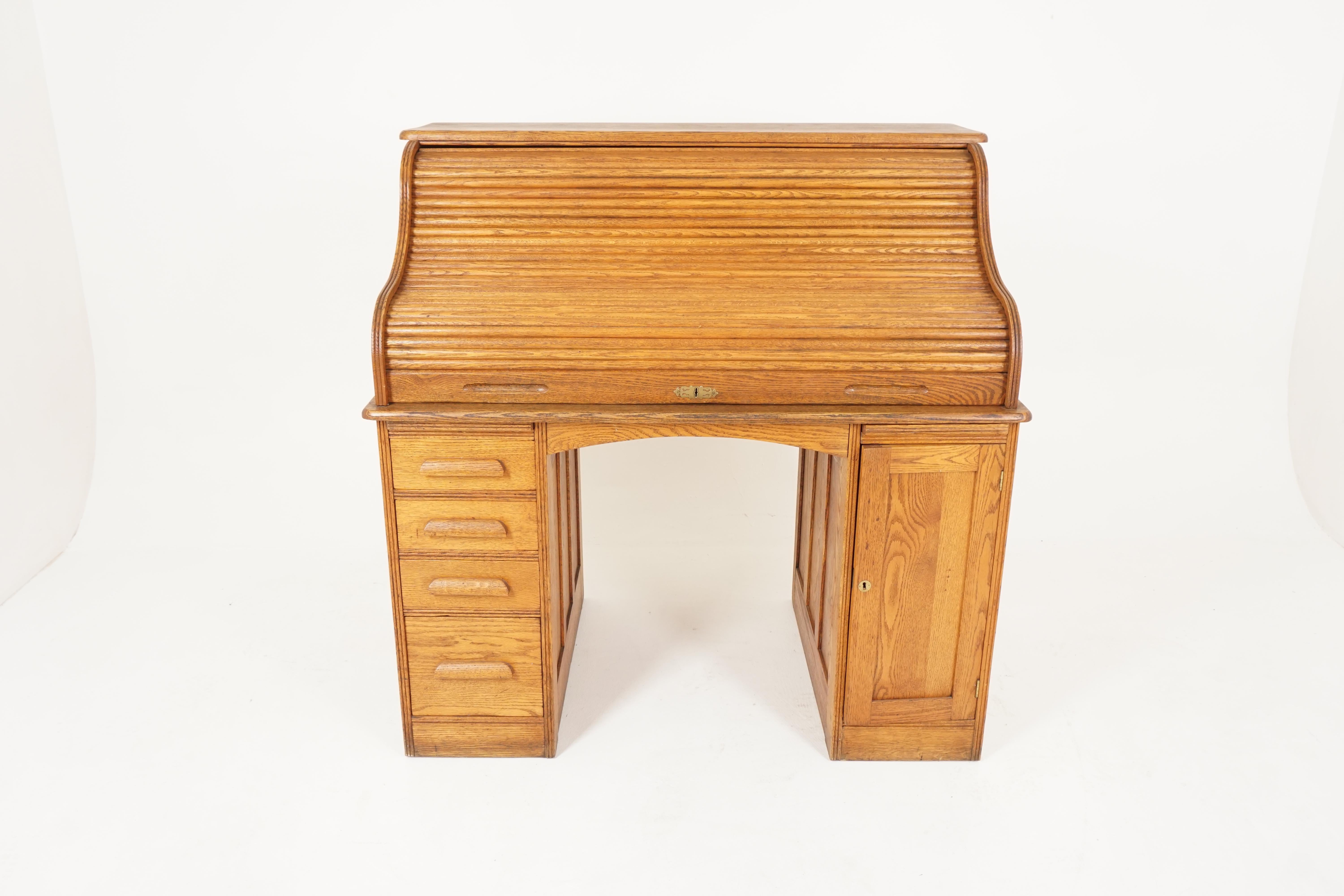 Antique oak roll top desk, double pedestal, American 1900, B2515 

American, 1900
Solid oak
Original finish
High back
Fitted interior with mail slot on the ends
Sitting on a pair of pedestals
The right side opens three cubby holes on top and
