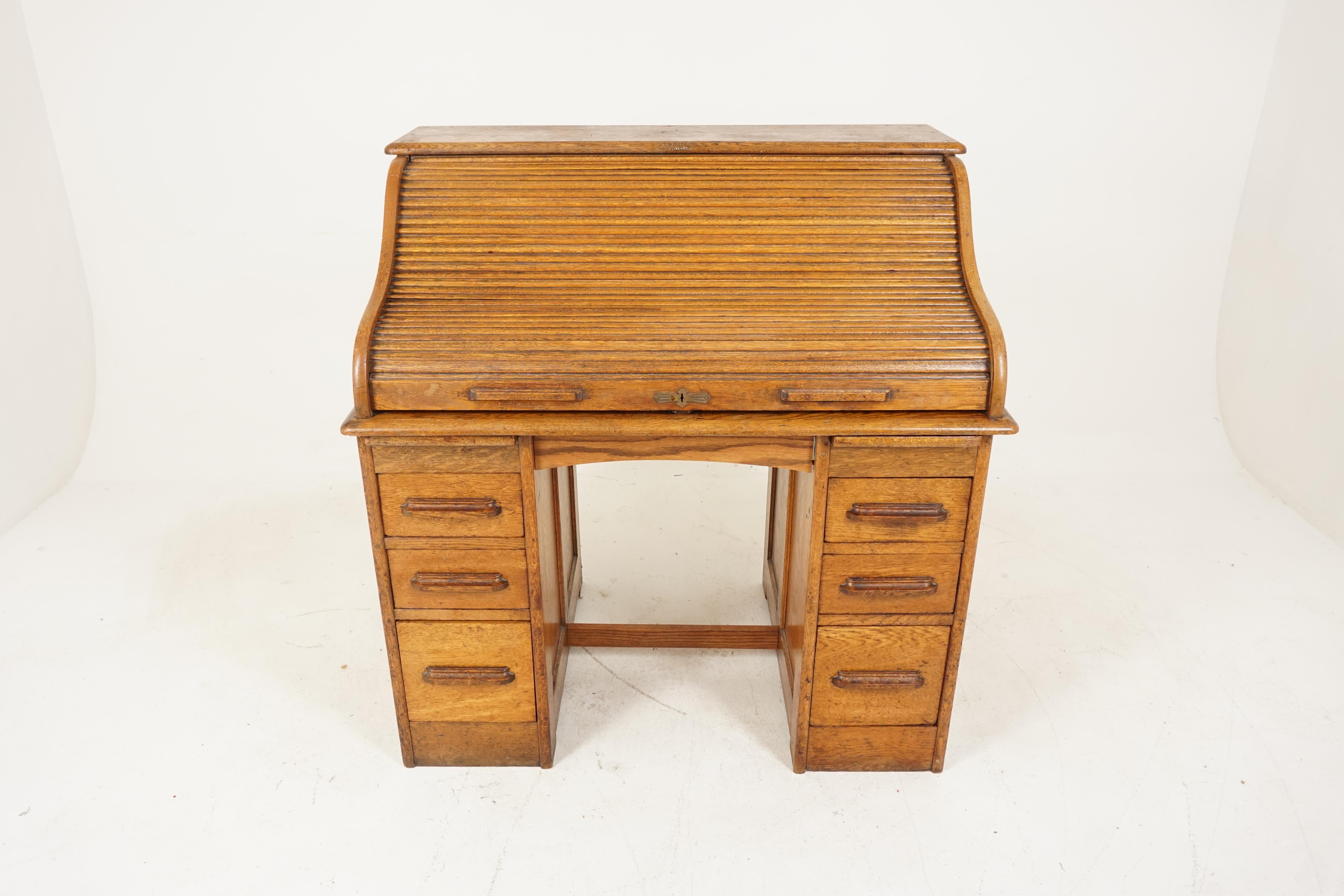 Antique oak roll top desk, Double Pedestal, American 1910, B2801

American 1910
Solid oak
Original finish
Rectangular moulded top
Good working tambour roll
Opens to reveal writing surface
Pair of drawers
Slide out pen holder with pigeon
