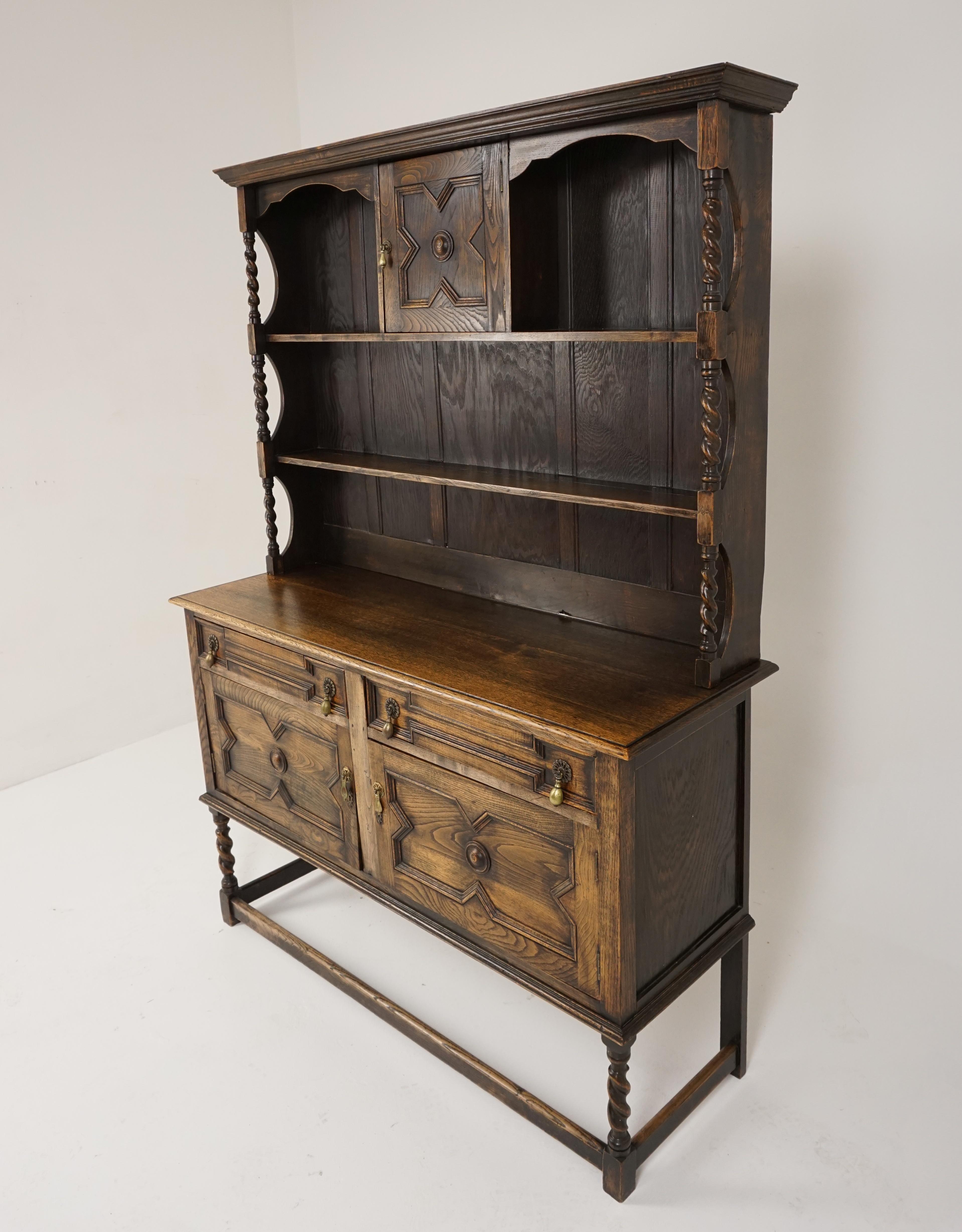 Antique oak sideboard, barley twist welsh dresser, buffet, Scotland 1910, B2850

Scotland 1910
Solid oak
Original finish
Moulded cornice above open shelving
A paneled door to the center
Barley twist supports on the ends
The base has two