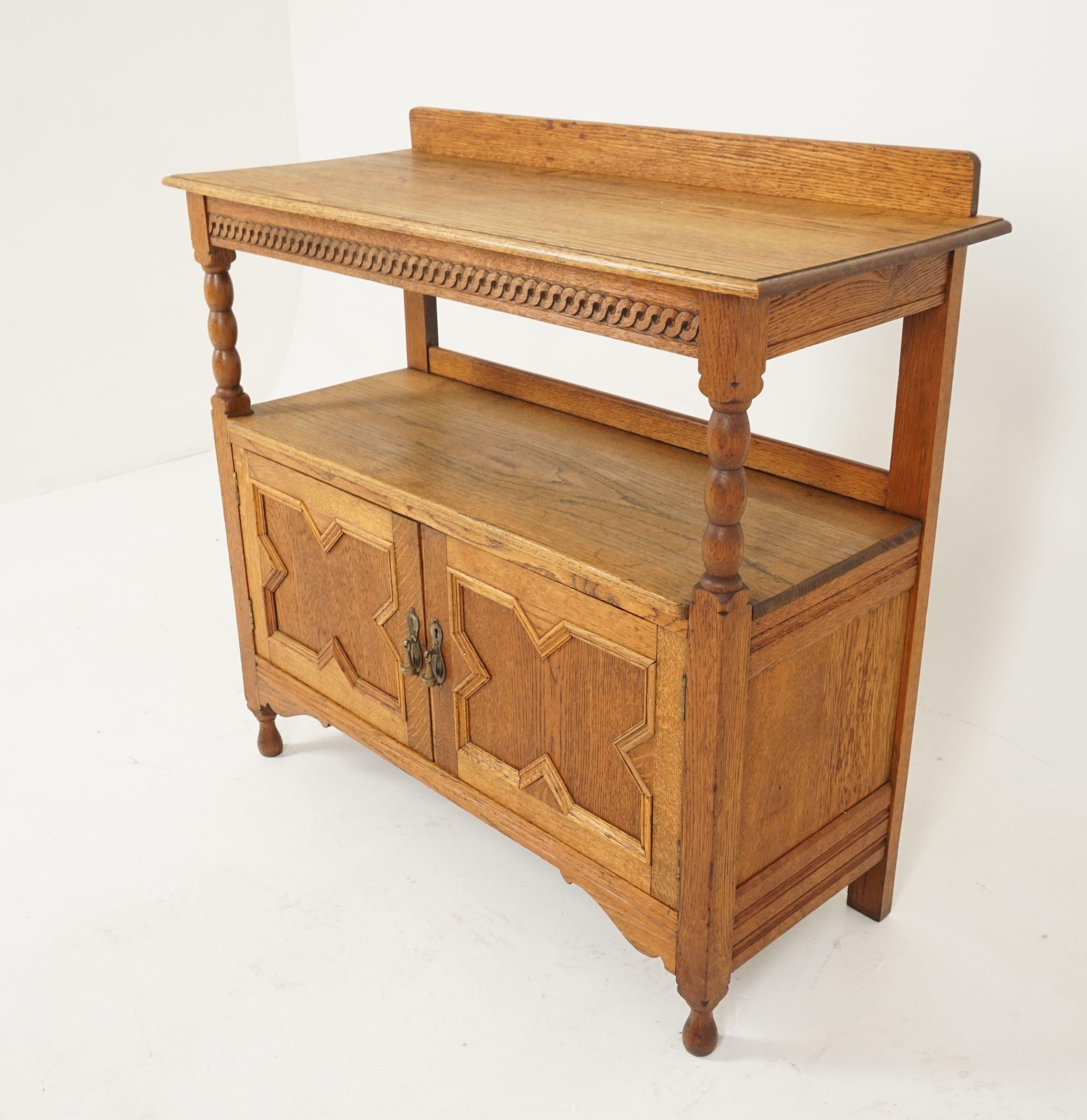 Antique oak sideboard, buffet, server, Scotland 1910, B2345

Scotland 1910
Solid oak
Original finish
Small raised back with rectangular moulded top 
Carved frieze underneath with two bobbin supports
Undershelf below
Pair of raised moulded