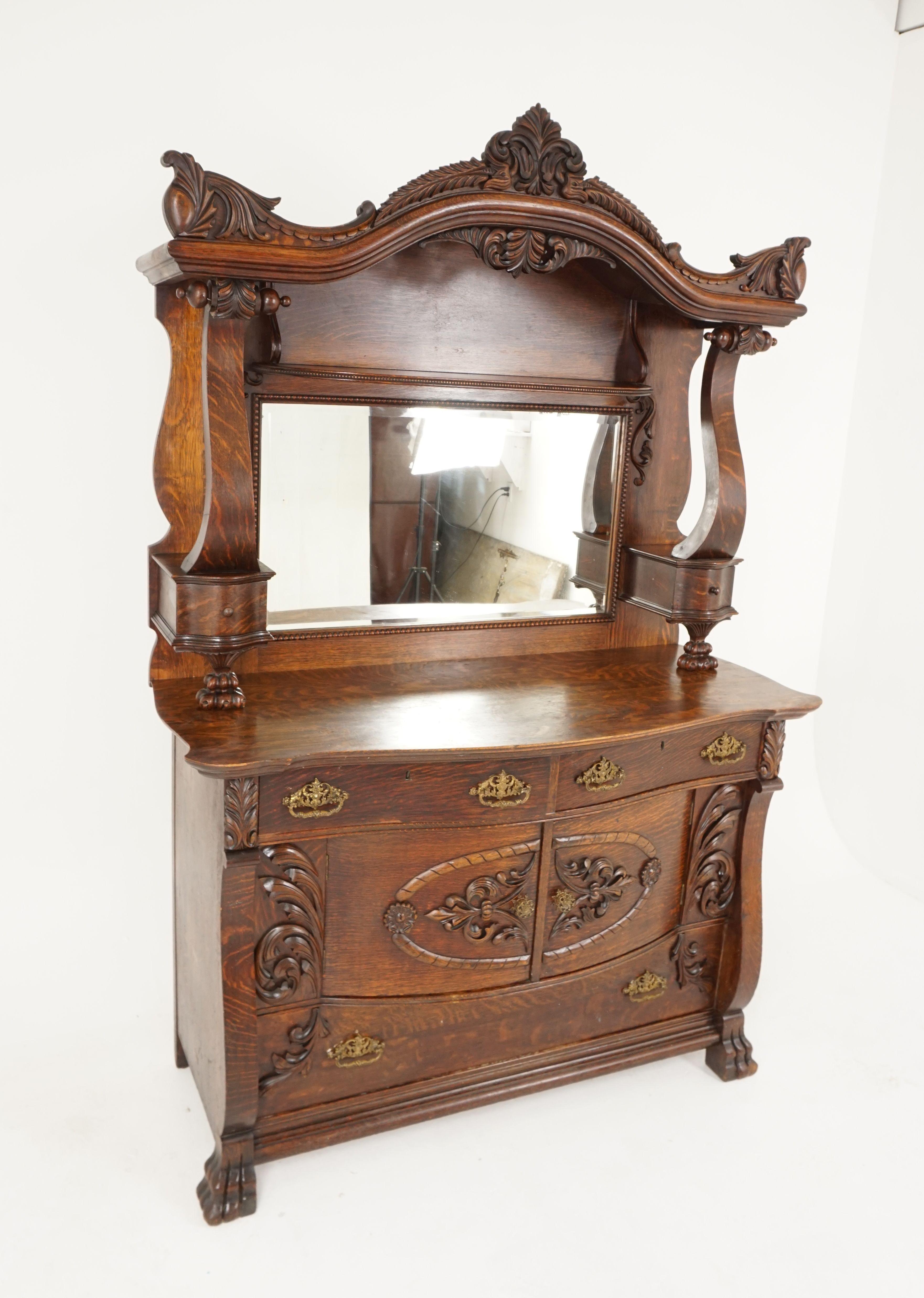 Antique oak sideboard, quarter sawn, mirror back, American 1910, B2483

American 1910
Solid oak
Original finish
Carved canopy on top with shaped underneath
Rectangular mirror with beading below
Pair of large shaped pillars with small drawer