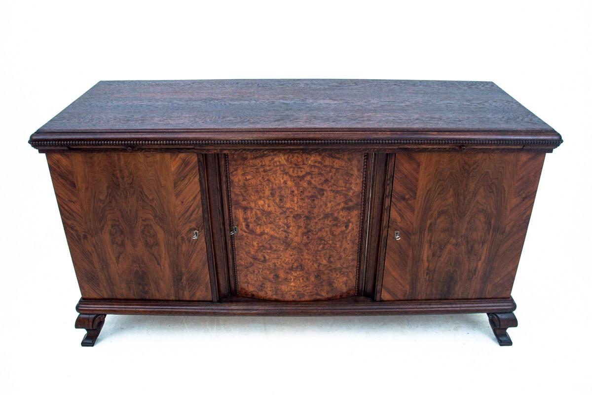 Antique sideboard credenza from around 1910. 
Furniture in very good condition, after professional renovation.
Made of oak wood. 
Dimensions: H 106 cm / W 202 cm / D. 71 cm.