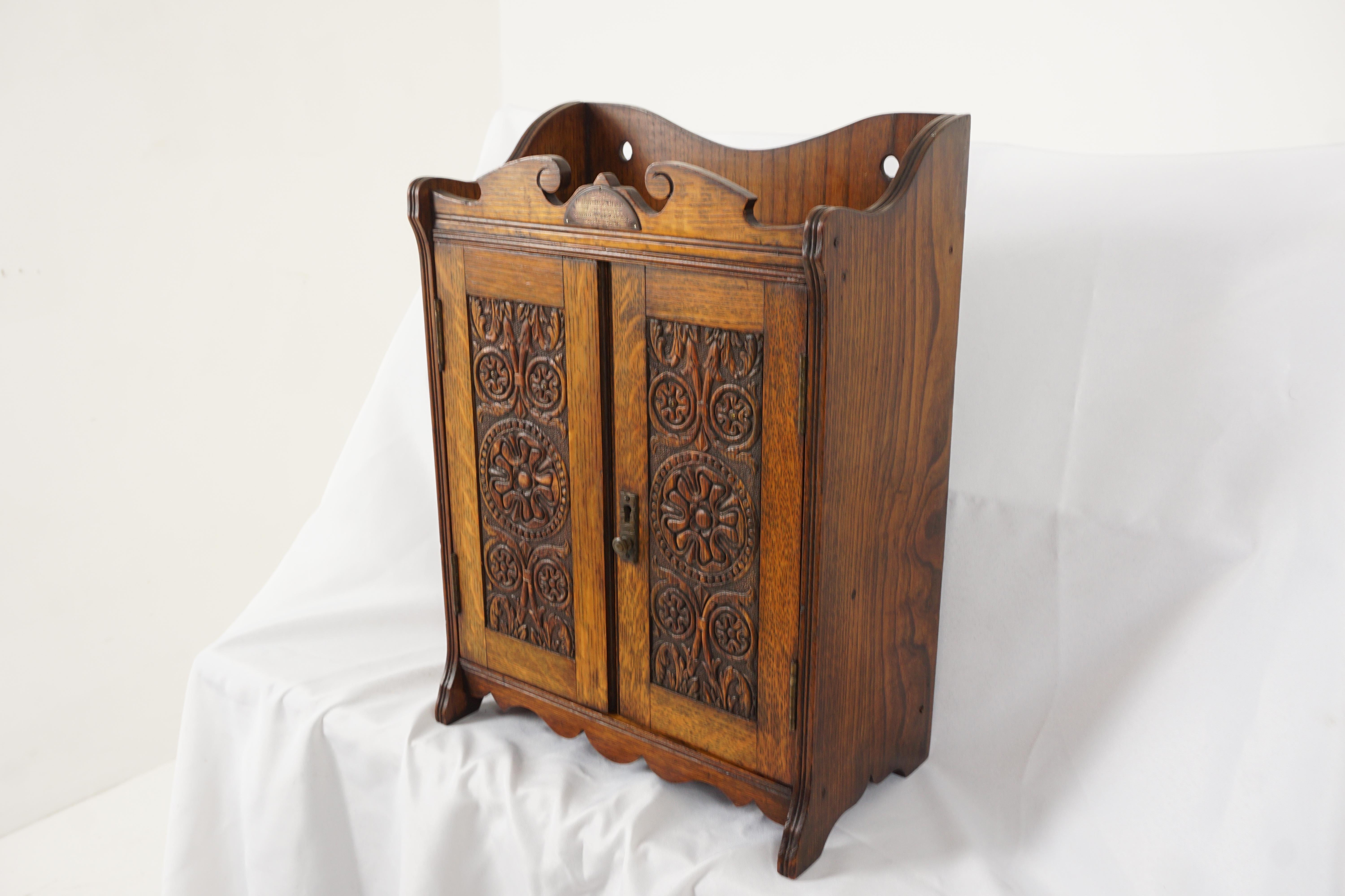 Antique oak specimen, smokers, pipe cabinet, Scotland 1906. H261

Scotland 
1906
Solid oak
Original finish
Three quarter gallery on top with shaped gallery on the front

Presentation brass plate which reads:
