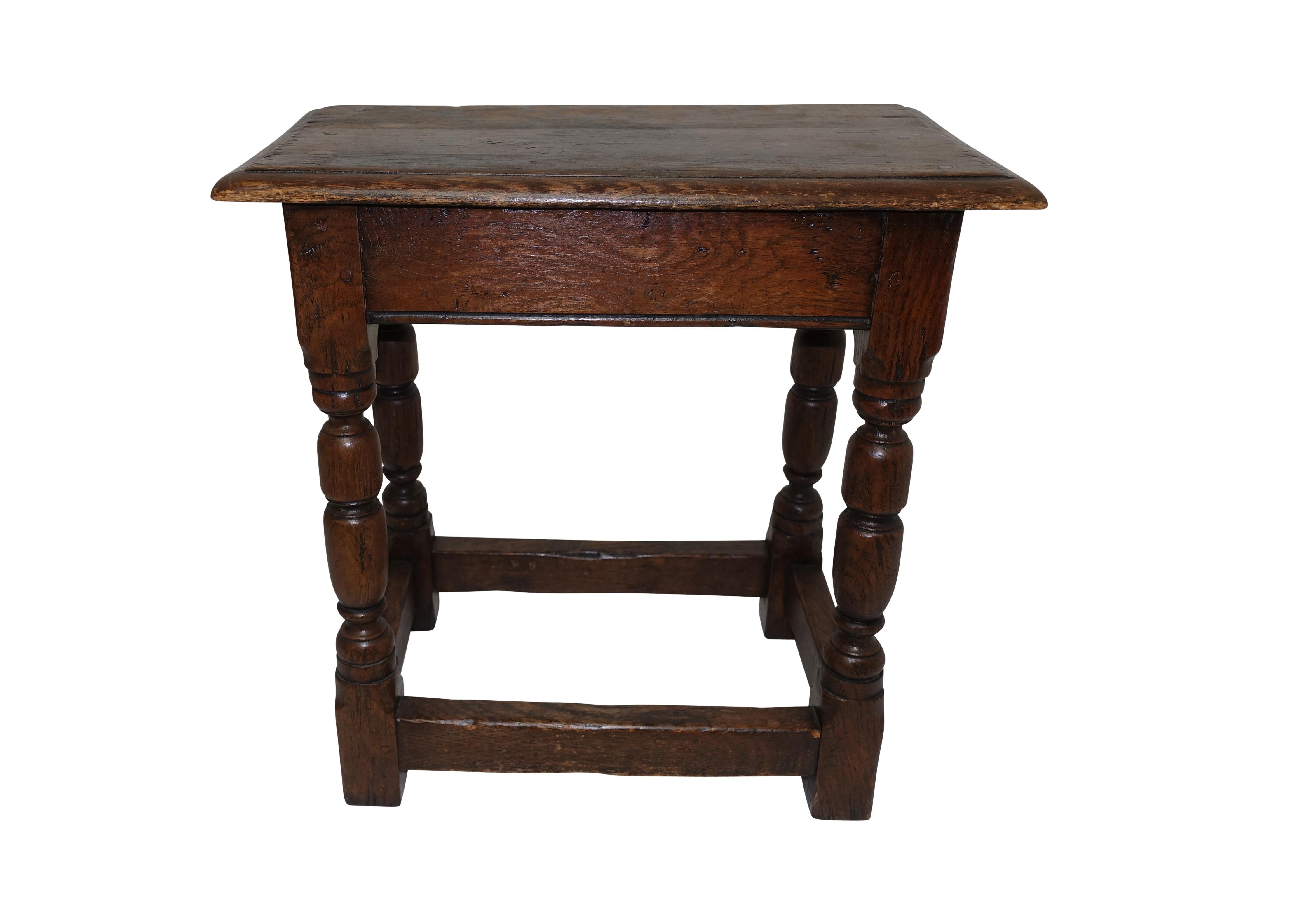 Handsomely aged and used oak stool, sturdy and sound, England, 19th century.