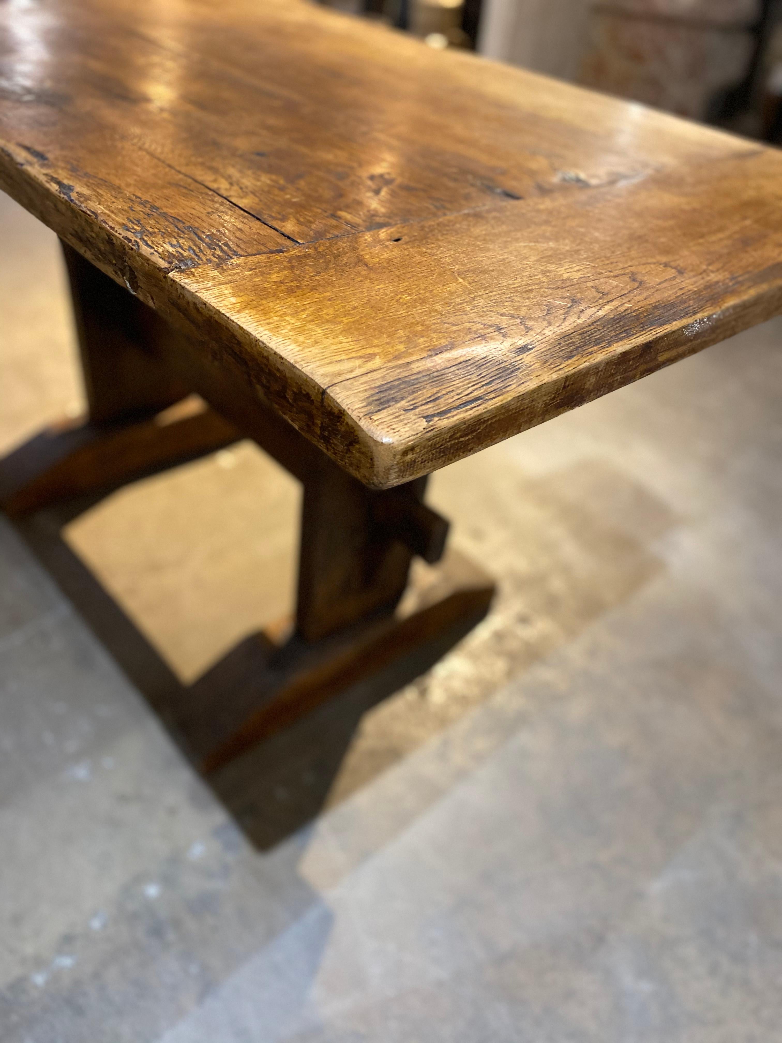 This antique table is made of oak, originates from France circa 1900, and makes for an excellent desk.

Measurements: 56” L x 29.5” D x 31” H.