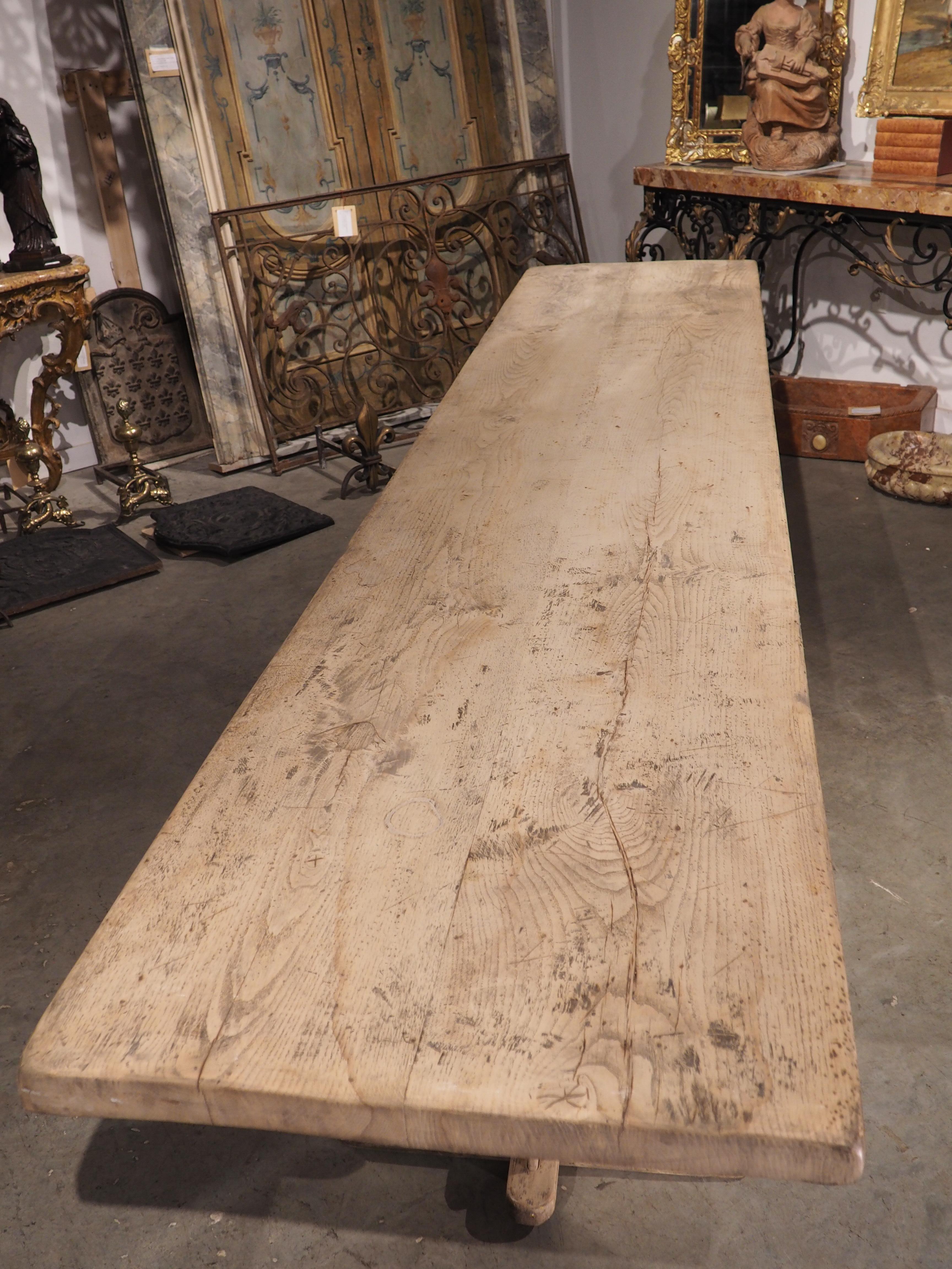 At over 11 feet long (137 ¾ inches), this antique dining table from Italy can seat 10-12 adults comfortably. The table was hand carved from oak wood in the 1800s in Asti, in the Piedmont region of northwestern Italy. It has been stripped of the
