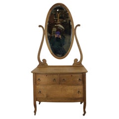 Antique Oak Three Drawer Dresser with Mounted Oval Mirror