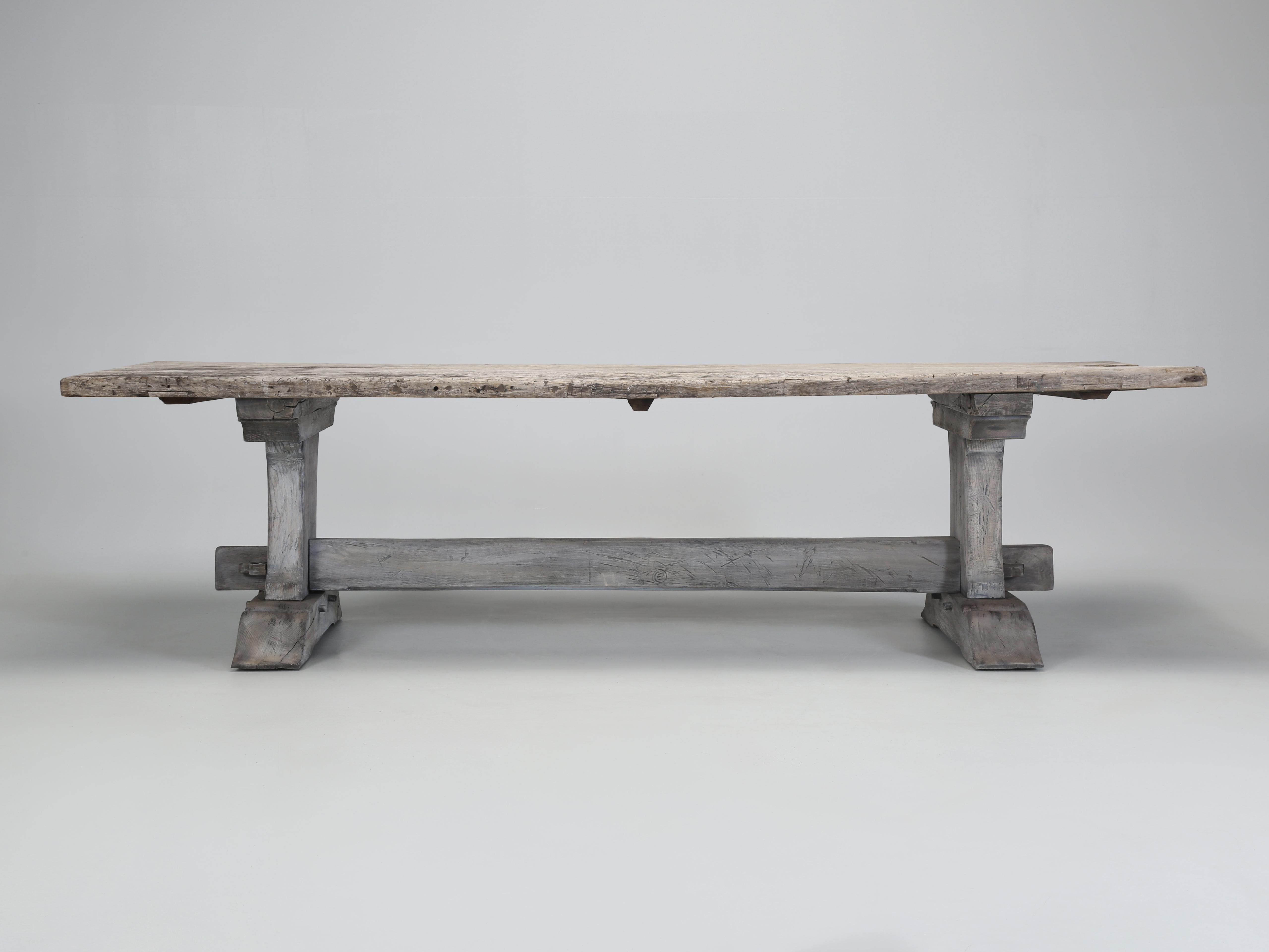 Antique Trestle Style Dining Table or Kitchen Table with a Very Rustic Table Top that has not been altered, however the table base did require restoration which is very typical of this style dining table. The best thing about our rustic country