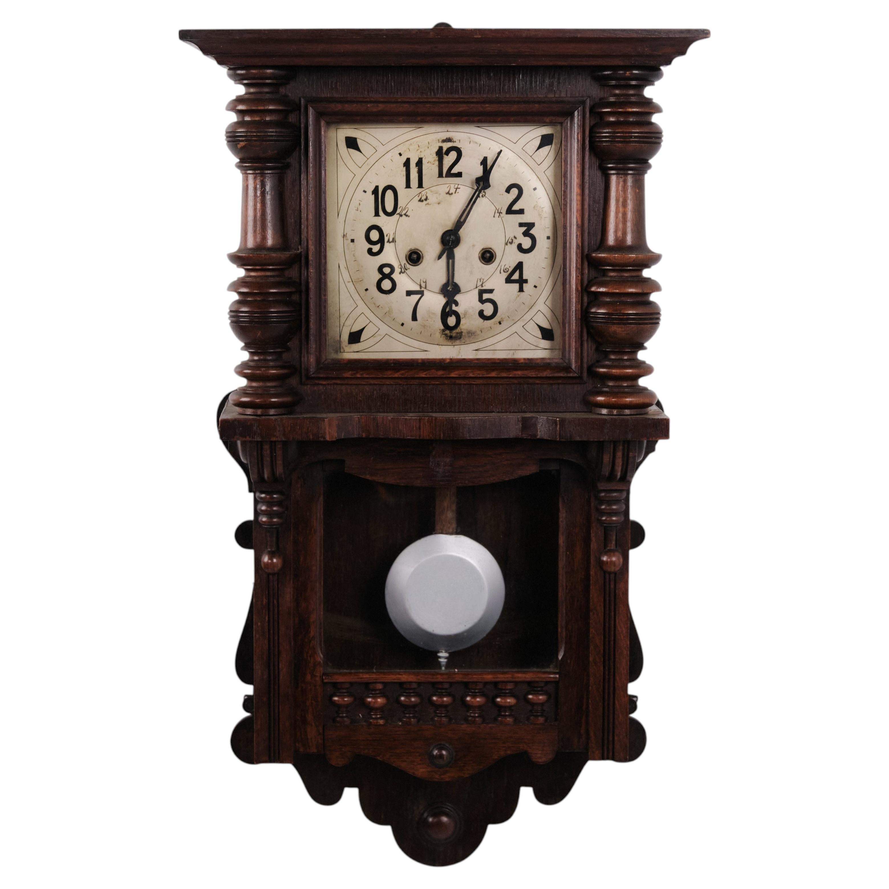 Antique Oak Wall Clock with Carved Details from the 1920s For Sale