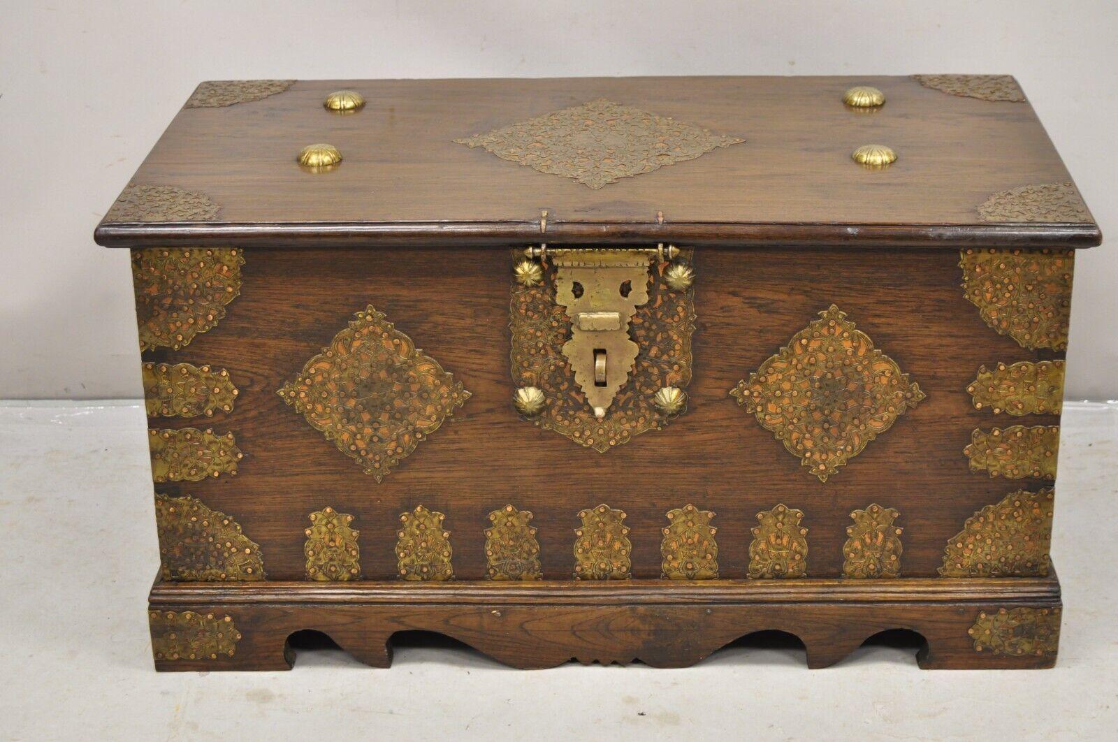 Antique Oak (possibly walnut) Wood & Brass Mounted Syrian Coffer Blanket Chest Trunk. Item features solid wood construction, beautiful wood grain, copper and brass decorative mounts, heavy solid brass hardware, very nice antique chest. Circa 190