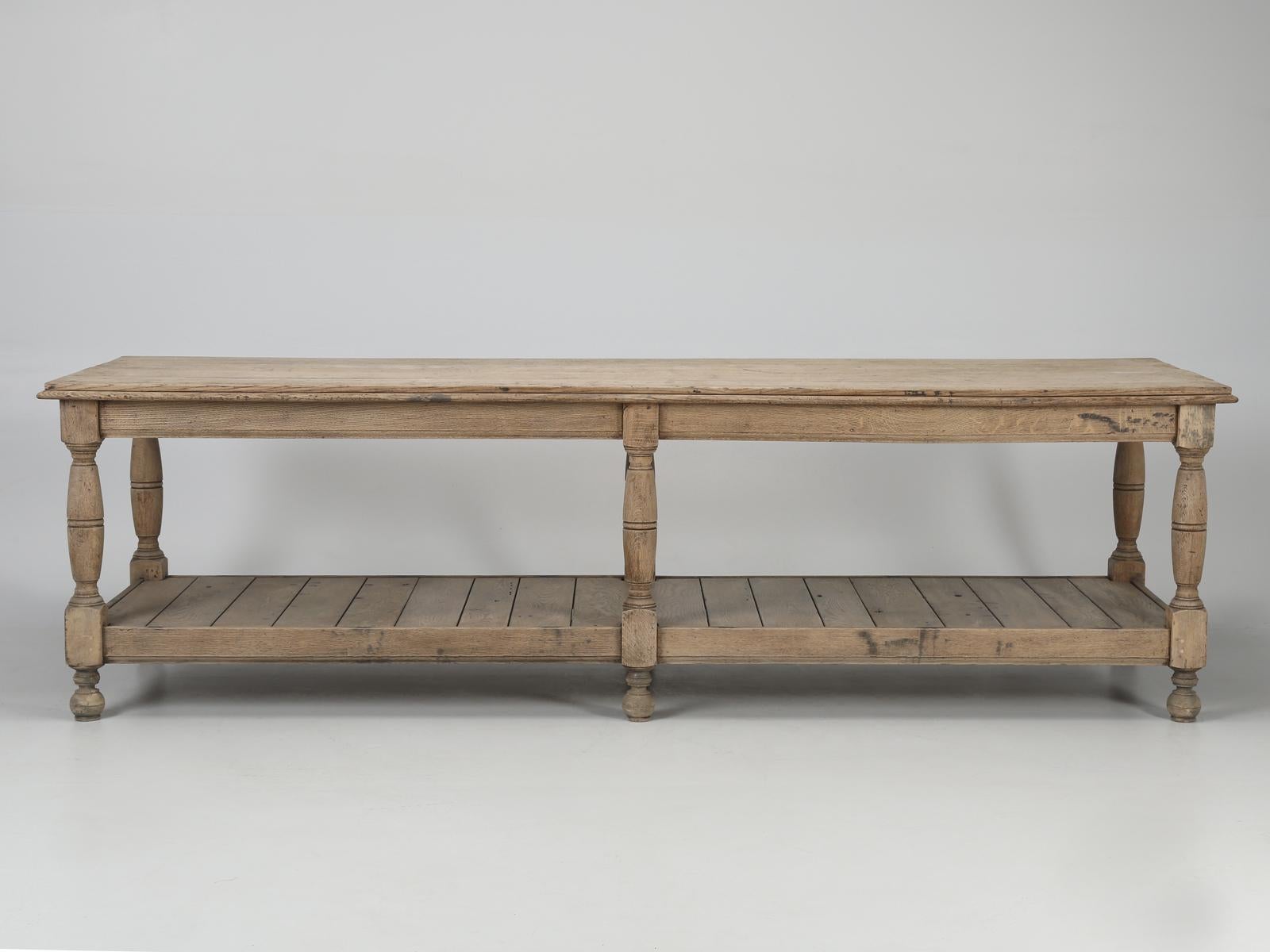 In Ireland, where we purchased this antique oak work table, it was described as an “antique oak refectory table, four plank top on six turned legs”. In France you might have called this industrial style table, a “draper’s table”, while in England,