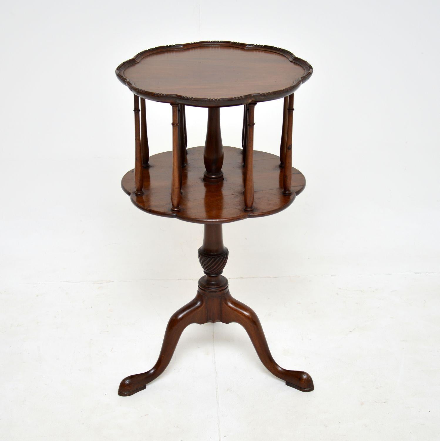 A beautiful and unusual antique occasional table. This was made in England, it dates from around the 1900-1910 period.

It is very well made, with a nicely shaped two tier top that revolves on the base. It is perfect for storing books and other