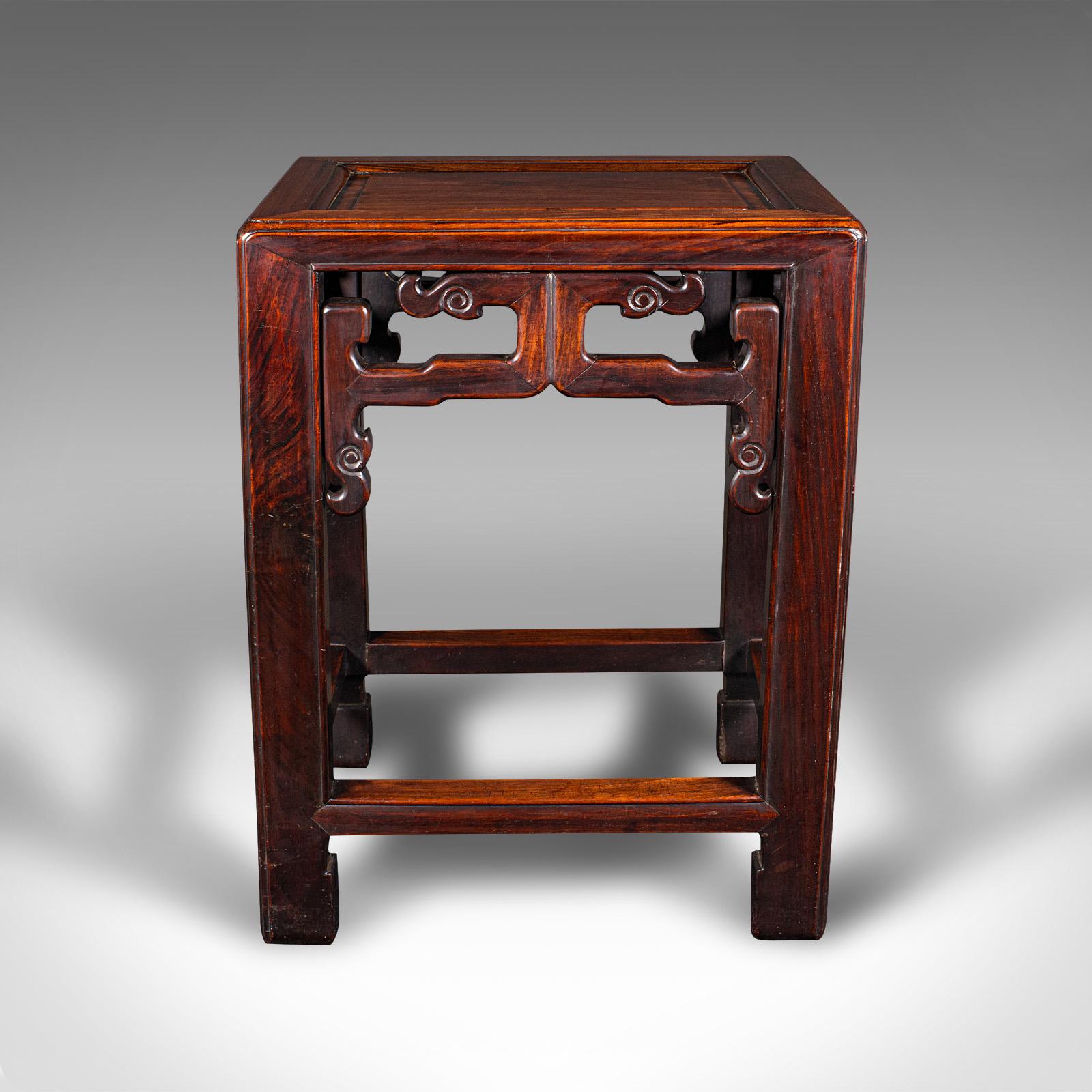 This is an antique occasional table. A Chinese, rosewood lamp table or jardiniere stand, dating to the late Victorian period, circa 1900.

Appealingly crafted small table with a substantial weight
Displays a desirable aged patina and in good