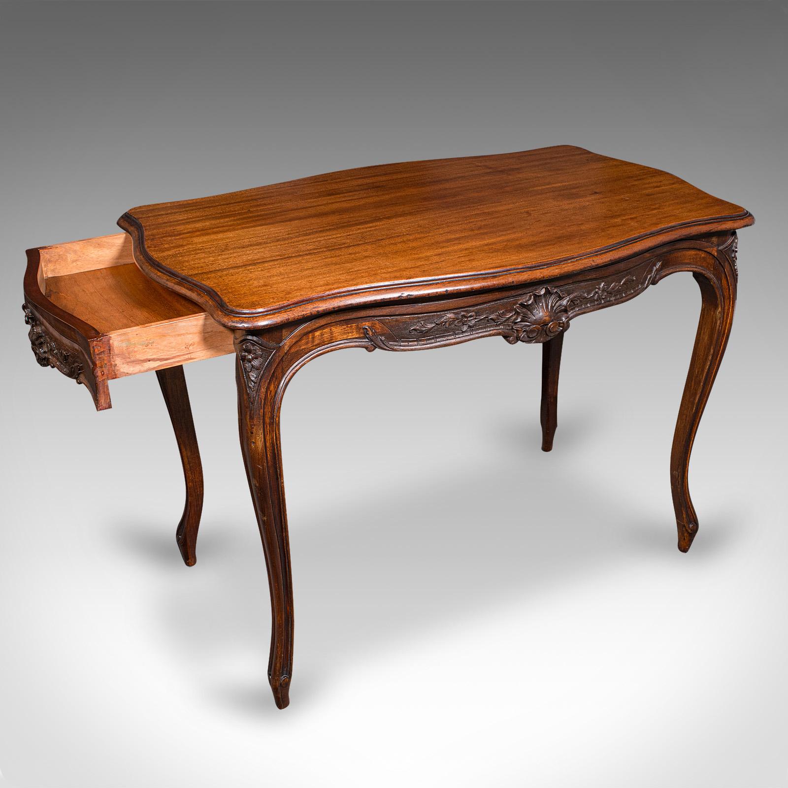 This is a superb antique occasional table. A French, mahogany centre table or desk, dating to the early Victorian period, circa 1850. Boasting an elegant form, exquisite carved detail, and fine grain interest — ideal as a central feature or a