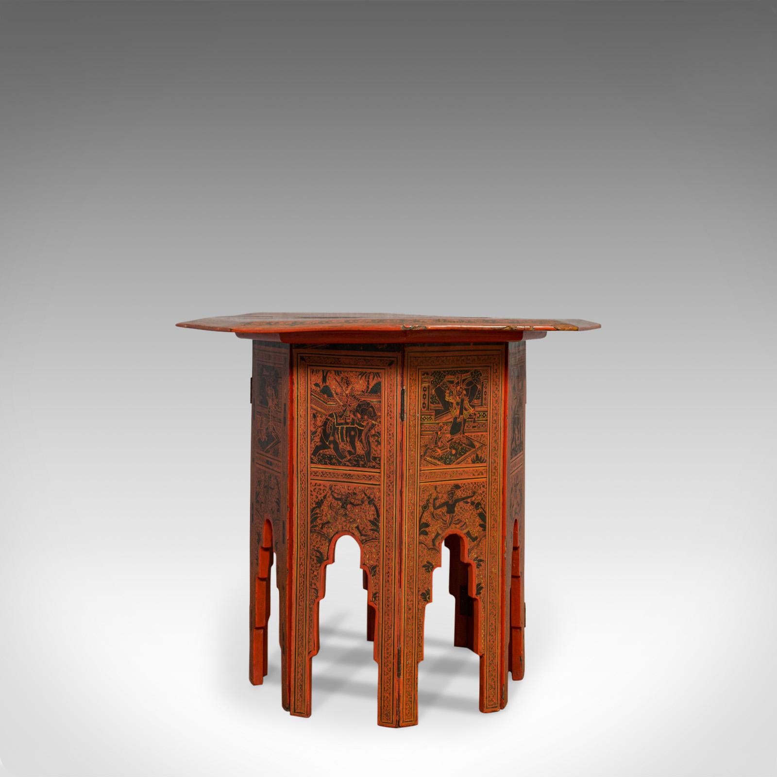 This is an antique occasional table. An English, Chinese elm octagonal coffee or lamp table in strong Moorish taste and dating to the mid-19th century, circa 1850.

Burnt red hues to the lacquered Chinese elm tabletop and legs
Aged running