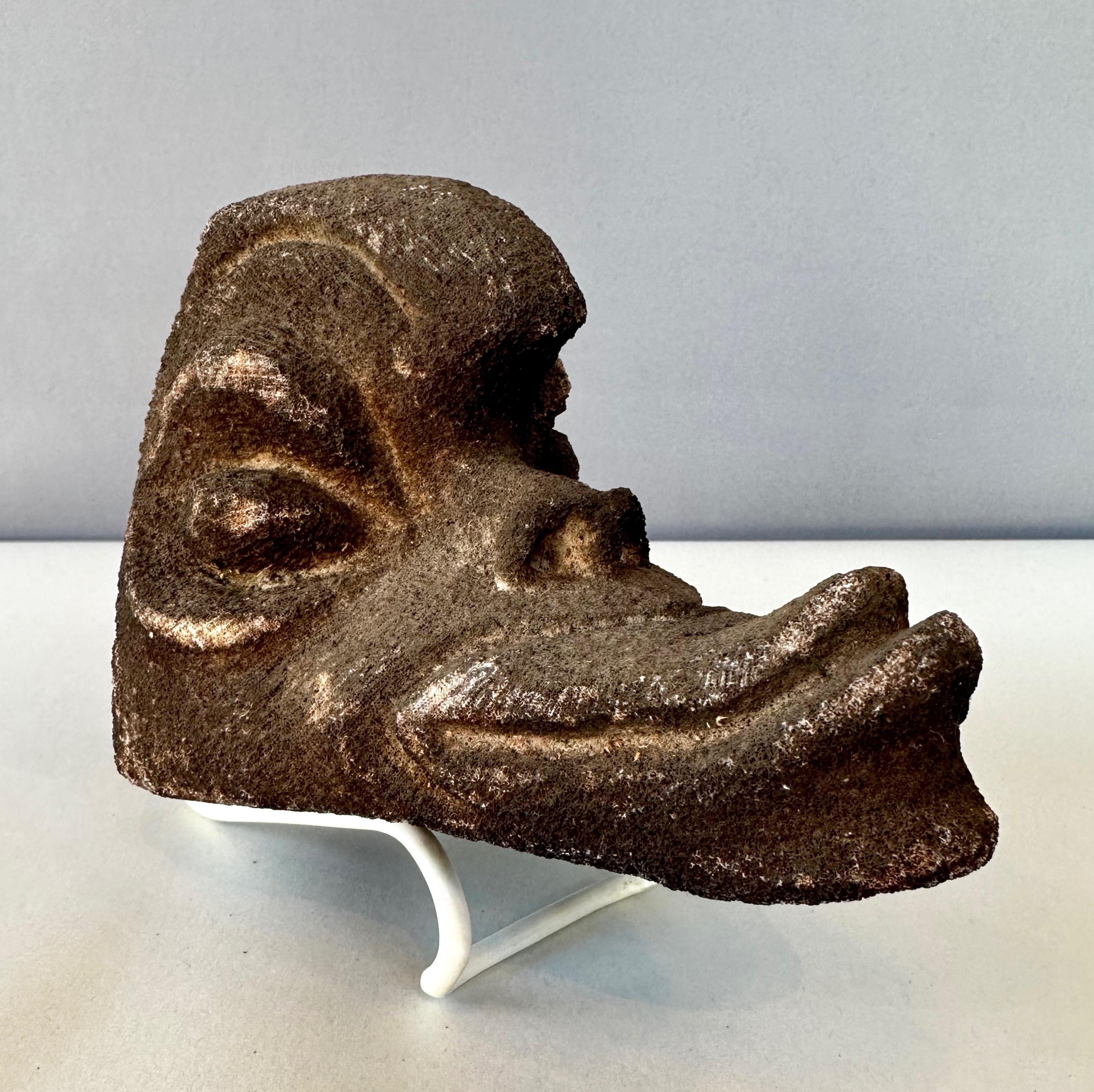 A rare Oceania Primitive carved coral ancestor’s head dating from the 1800s, if not significantly earlier.

Hand carved from a solid piece of white coral that’s been “blackened” via soot, soil, or stain that gives it a dark brown color, and at first