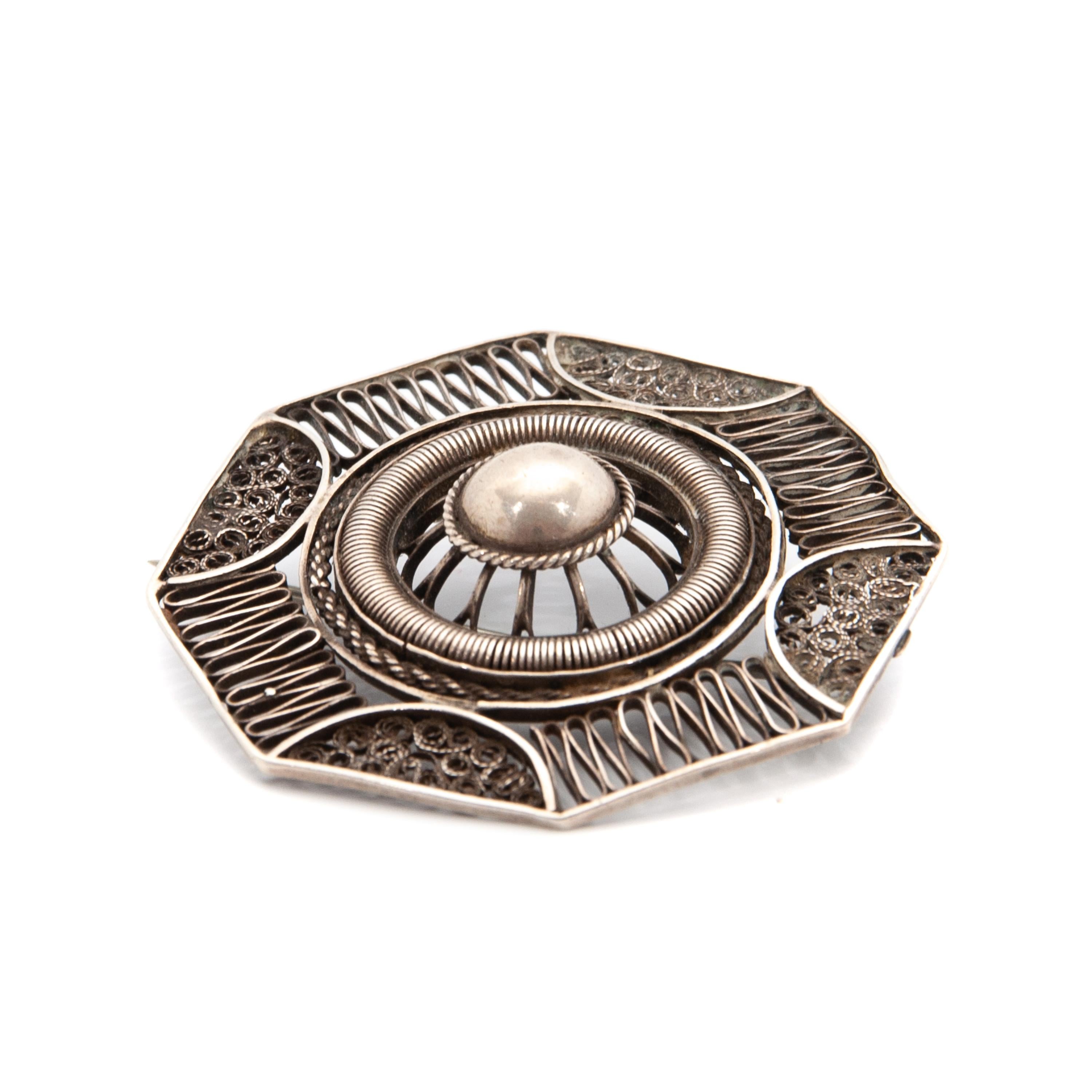 This beauty is searching for a new home! Maybe with you, or to give as a gift to your loved one?! 
Please visit our 1stDibs Heztia Storefront to discover more of our collection.

Vintage silver brooch which is finely crafted with cannetille and