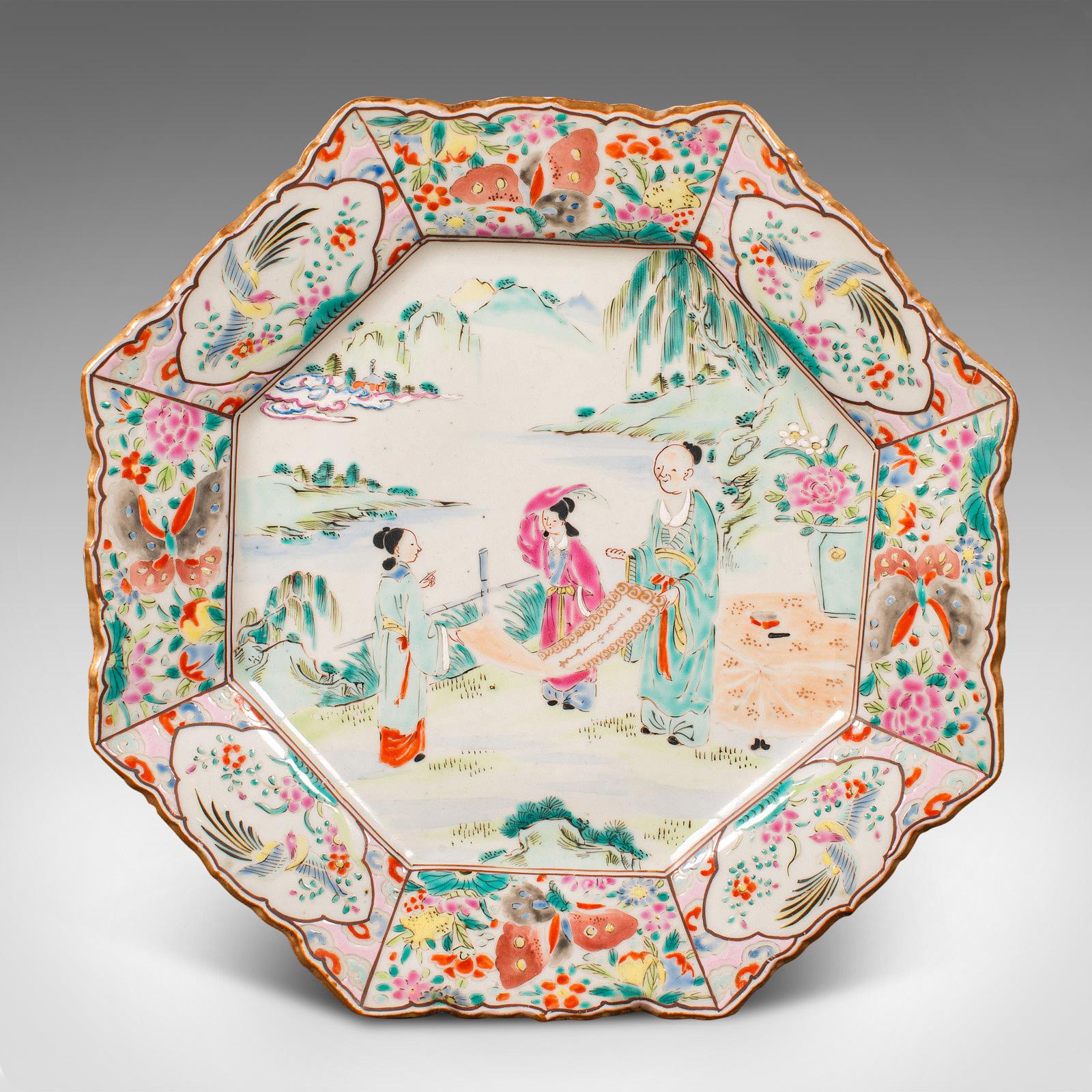 This is an antique octagonal serving plate. A Japanese, ceramic decorative charger, dating to the late Victorian period, circa 1900.

Vibrant and charming, with a wonderful decorative appeal
Displays a desirable aged patina and in good order
White
