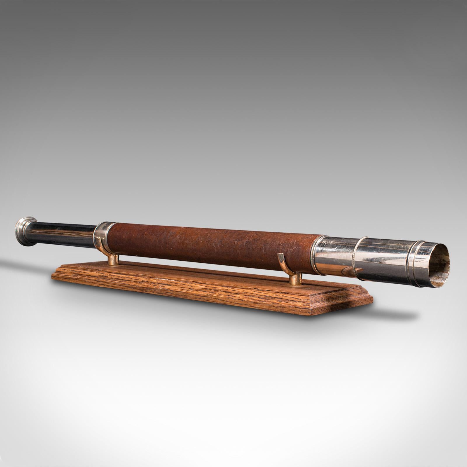 This is an antique officer of the watch telescope. An English, leather and nickel silver single draw refractor for terrestrial or astronomical use, by Ross of London, circa 1920.

Perfect for bird watching, landscape appreciation, wildlife, or
