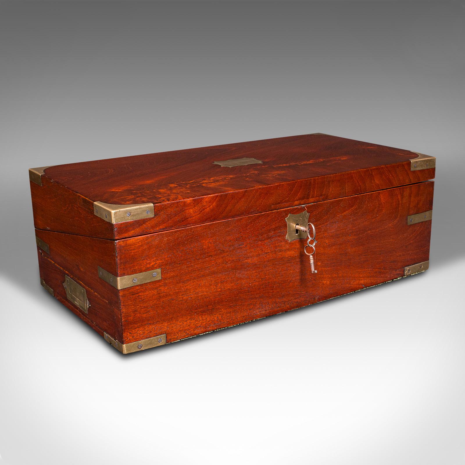 This is an antique officer’s campaign correspondence box. An English, flame mahogany and leather writing case, dating to the Regency period, circa 1820.

Delightfully attractive box, with fascinating secret drawers and quality finishes
Displays a