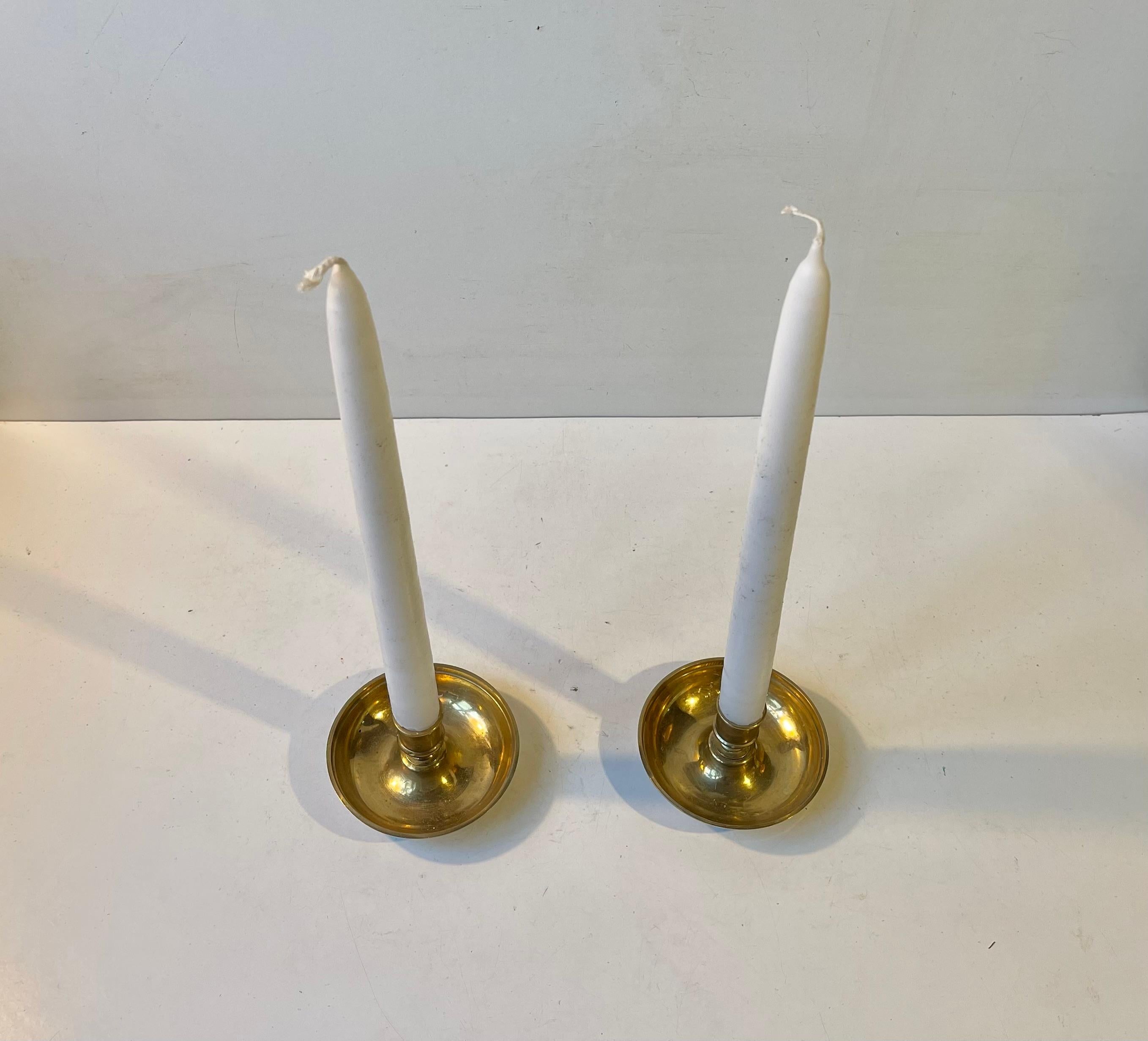 A bun shaped brass container that transforms into two candlesticks. Its commonly known under the name 'Officer's Campaign - Travel Candlesticks'. These were used by both the English and US military from the civil war and up to circa 1900. This