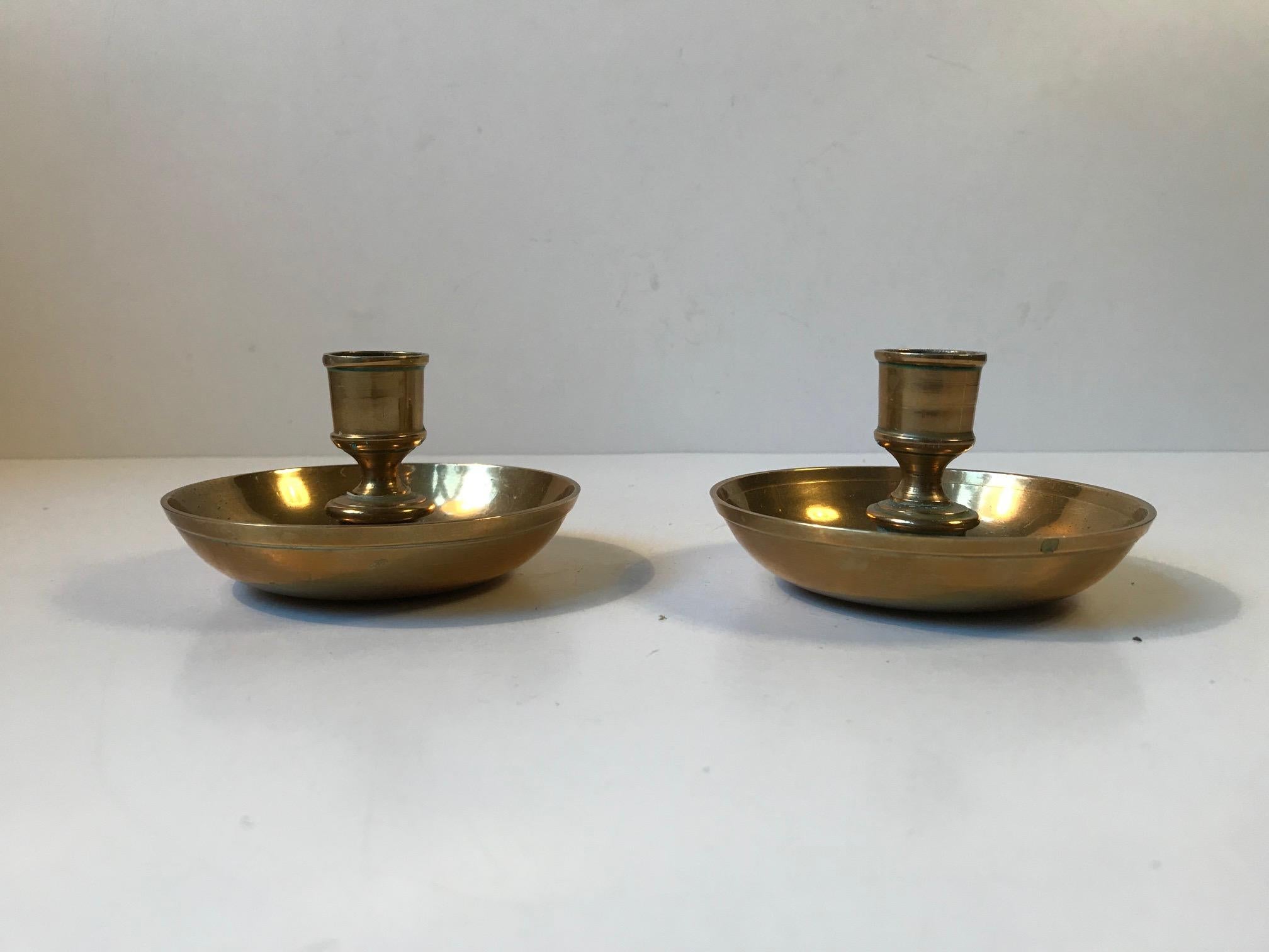 A bun shaped brass container that transforms into two candlesticks. Its commonly known under the name 'Officer's Campaign - Travel Candlesticks'. These were used by both the English and US military from the civil war and up to circa 1900. This