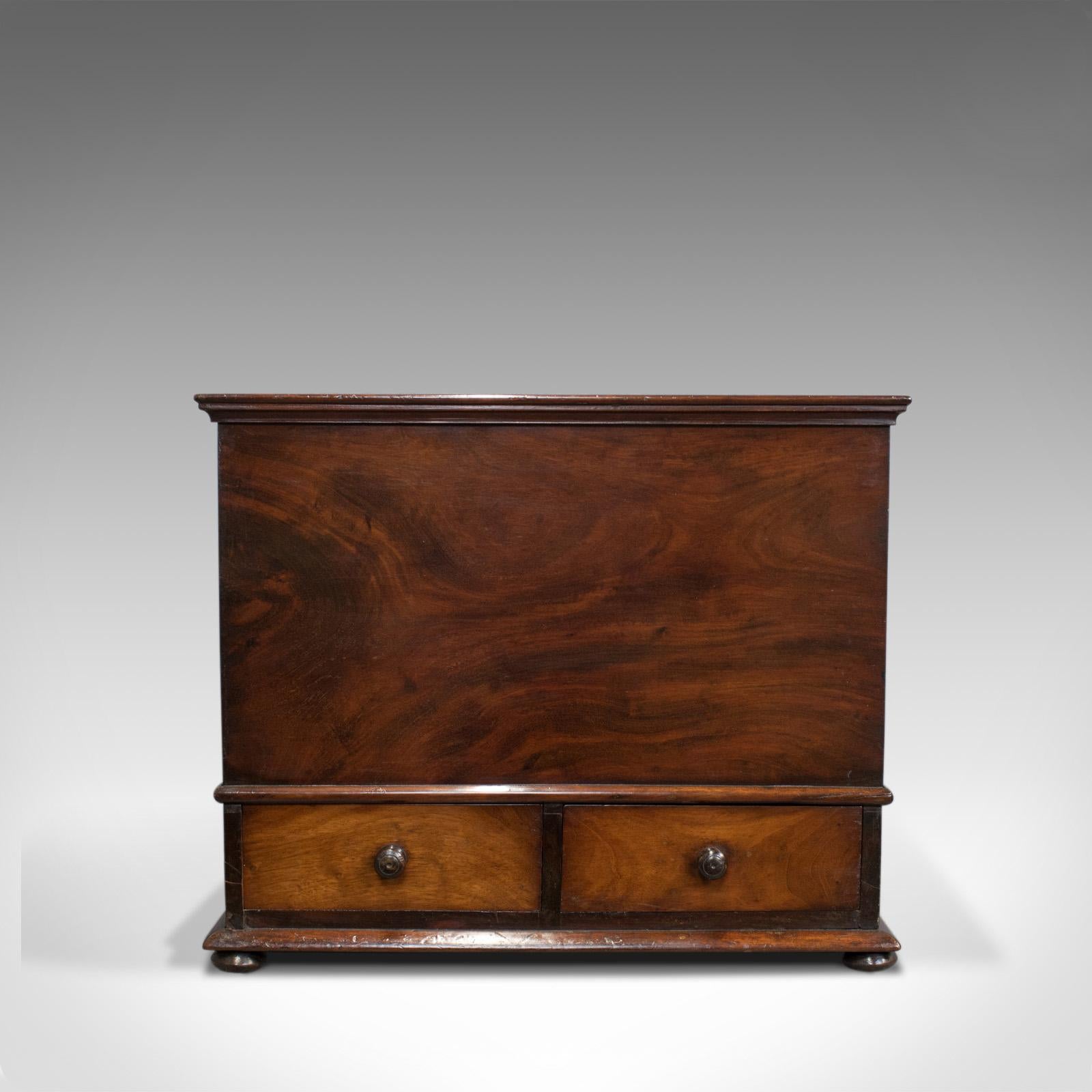 This is an antique officer's chest. An English, Victorian storage box crafted in flame mahogany dating to the mid-19th century, circa 1850.

Flame mahogany displaying good consistent color and grain interest
In superb original condition with a