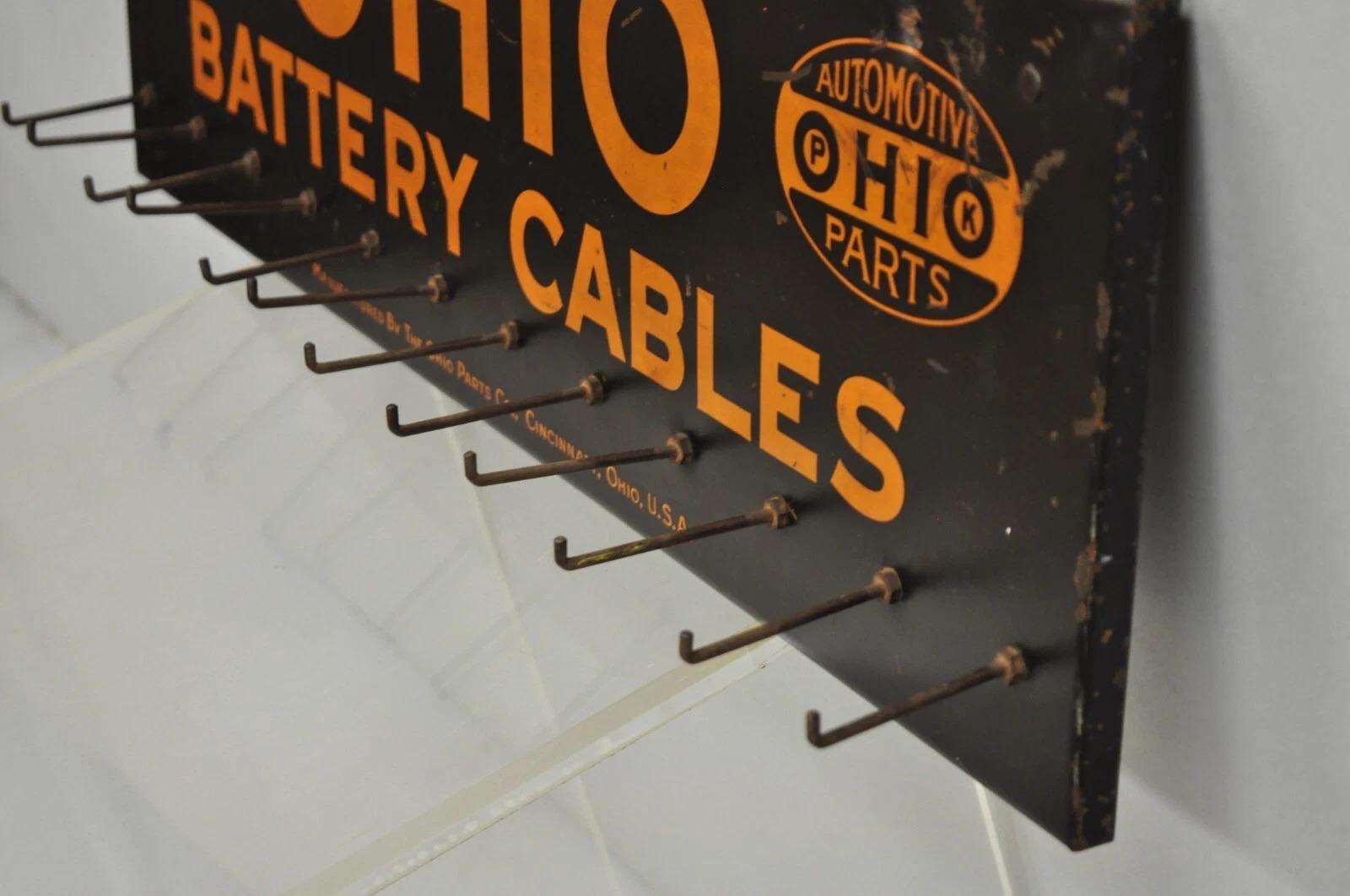 Antiguo Ohio Cables de la batería Estaño Metal Negro y Naranja Tienda de piezas Display en venta 6