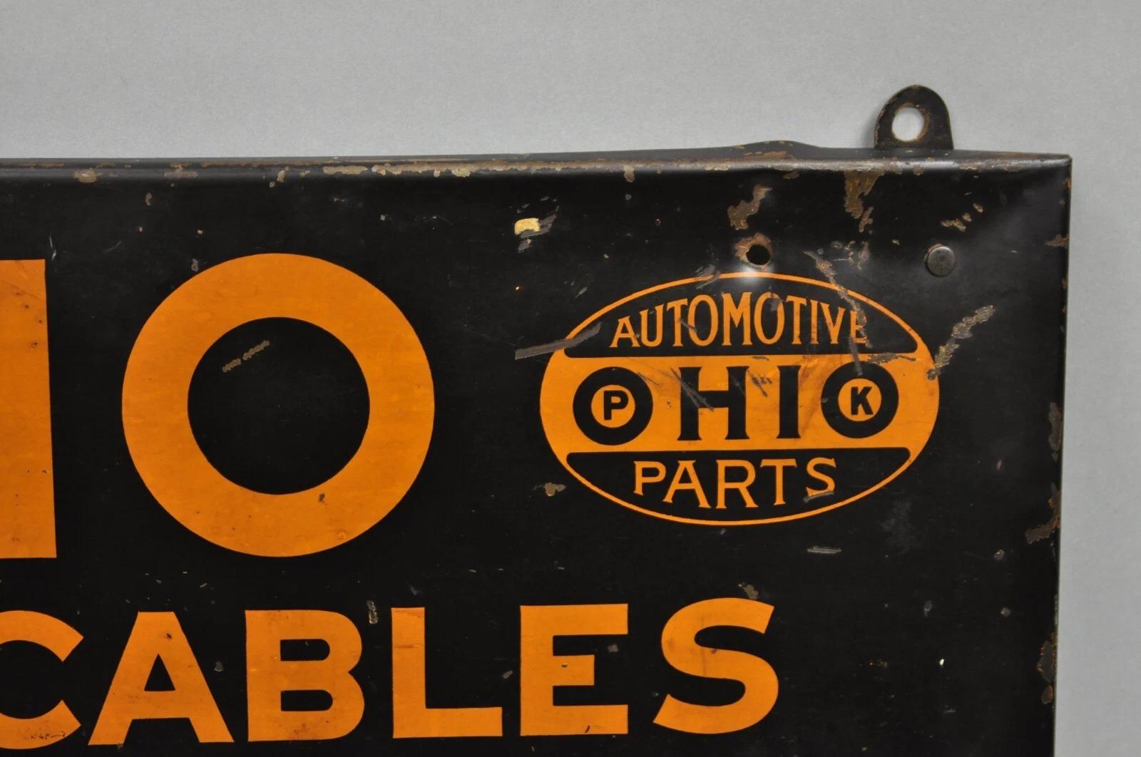 Antiguo Ohio Cables de la batería Estaño Metal Negro y Naranja Tienda de piezas Display en venta 1