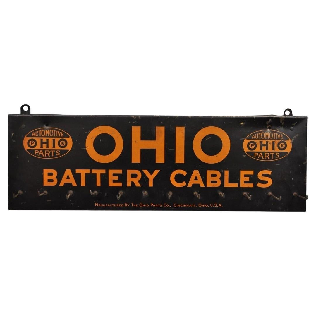 Antiguo Ohio Cables de la batería Estaño Metal Negro y Naranja Tienda de piezas Display en venta