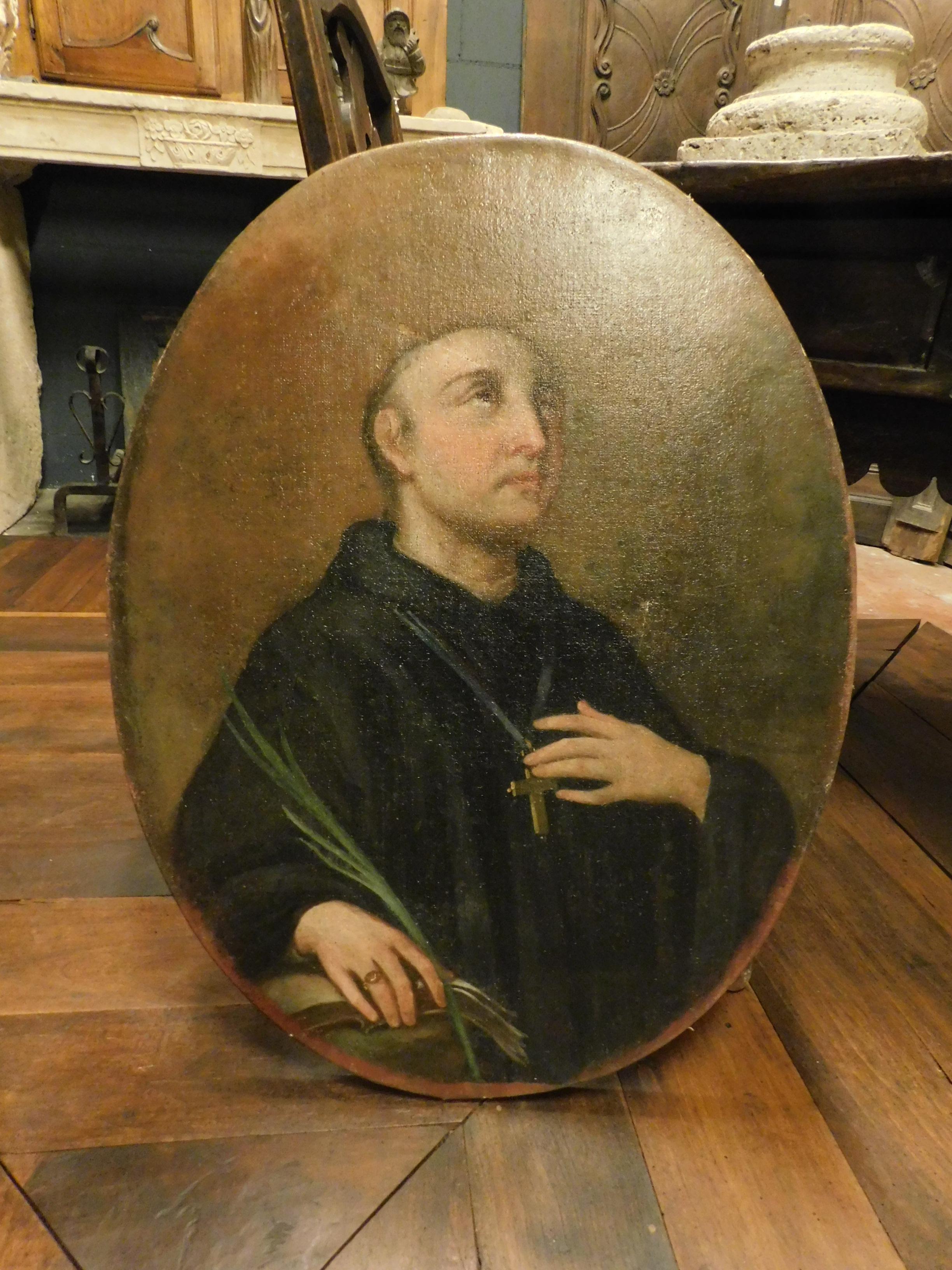 Ancient handmade painting with oil color on canvas, holy portrait, original from the 19th century, comes from a noble residence in Italy.