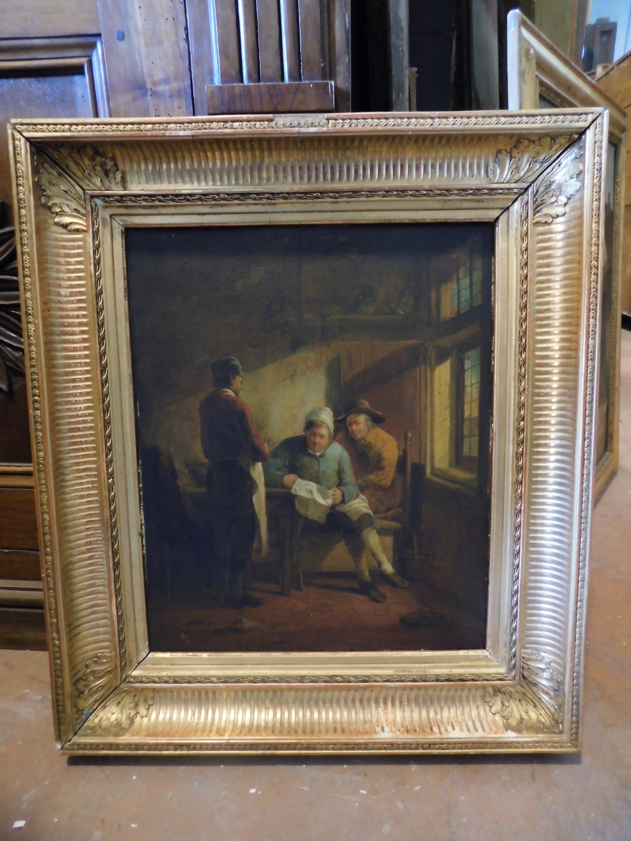 Ancient oil painting on canvas, depicting a typical scene of the time, with people reading and commenting, a peasant territory with a scene of everyday life, it still has an original golden contemporary frame, produced in the late 1800s in Italy by