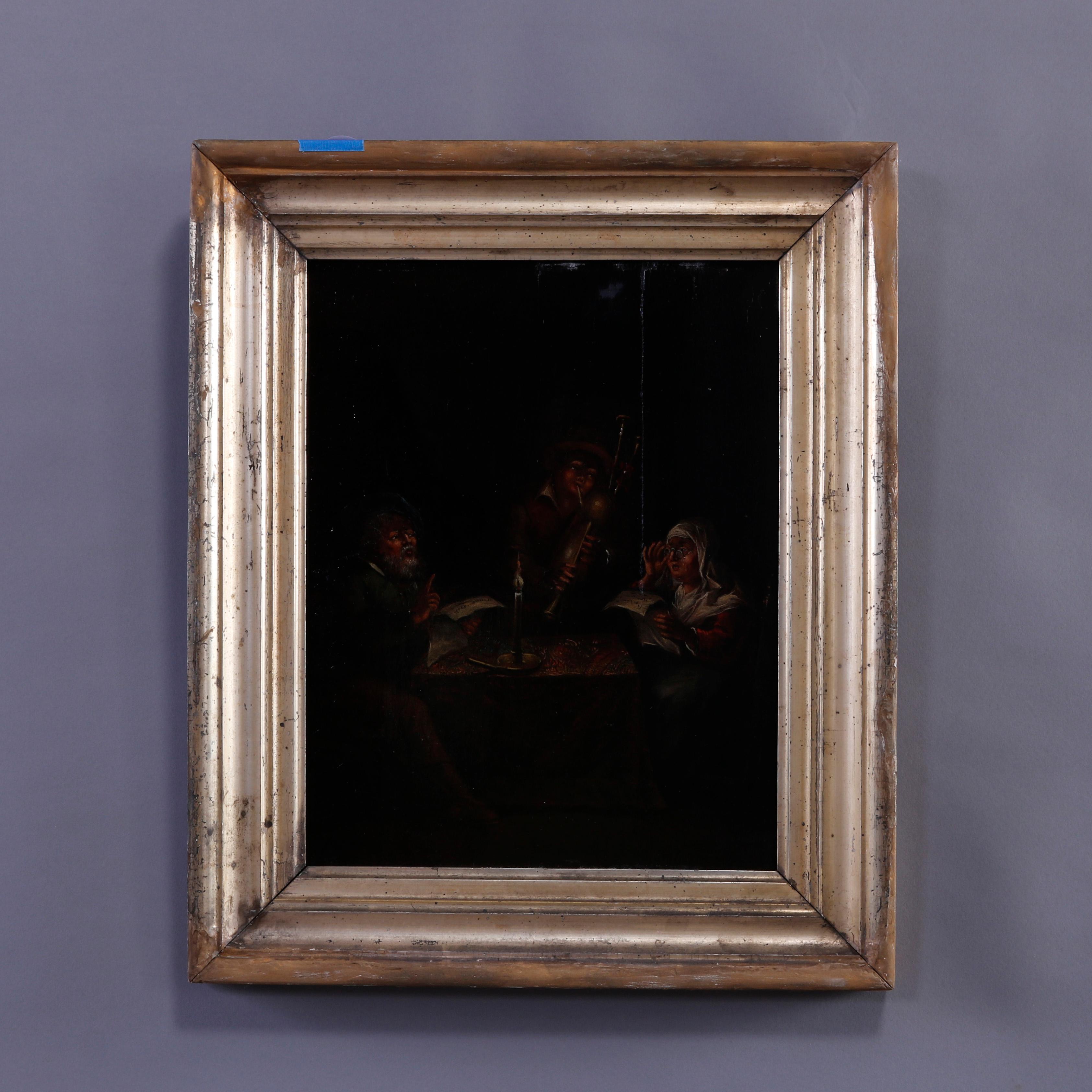 An antique painting offers oil on board interior genre tavern scene with couple and bagpipe player, unsigned, seated in giltwood frame, c1850

Measures - overall 18''H x 15''W x 2''D; sight 11'' x 14''.