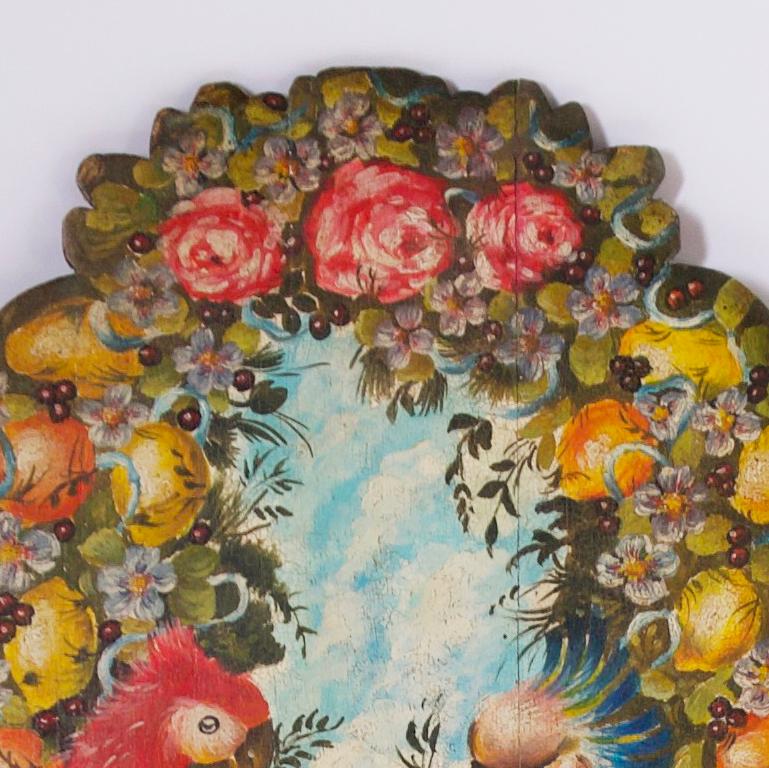 Charming 19th century oil painting on boards cut to the shape of the painting depicting two parrots in a garden with fruit and flowers on a classical stand. 
