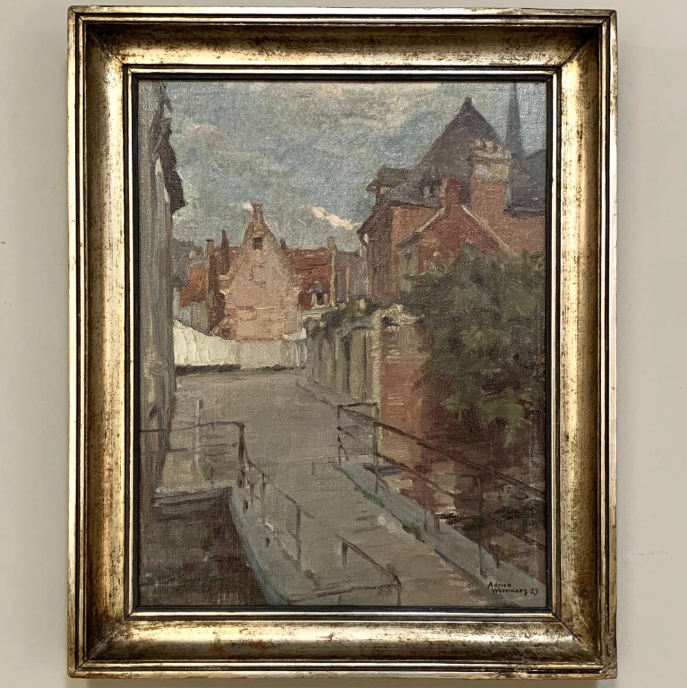 Antique oil painting on canvas by Adrien Wernaers (1899-1977) is a wonderful rustic cityscape with subtle coloration and splendid composition. Typical of the artist's work, it showcases the intriguing perspective of village life that is still at