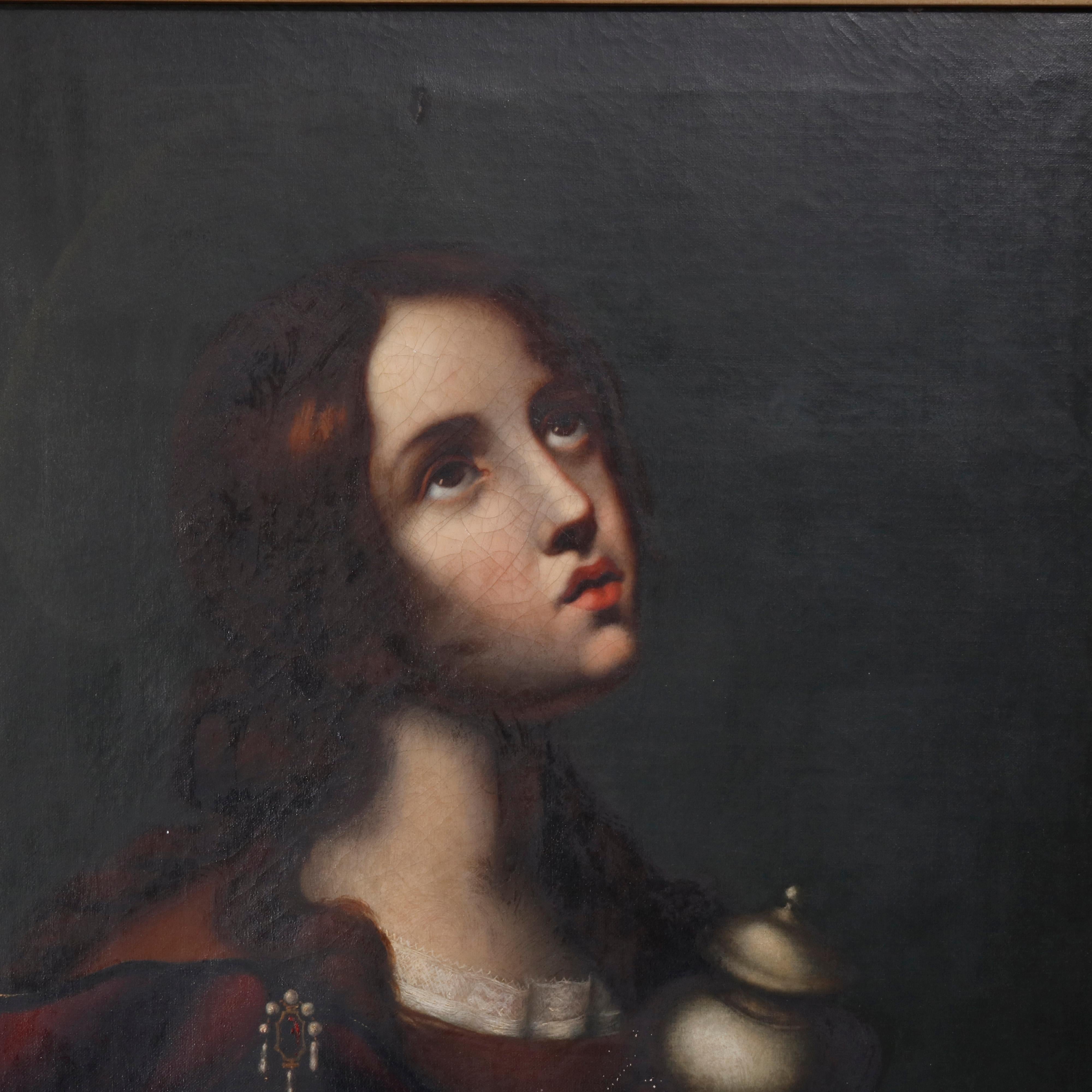 An antique oil on canvas old master painting depicts Mary Magdalene seated in giltwood frame, 19th century

Measures: 36.75