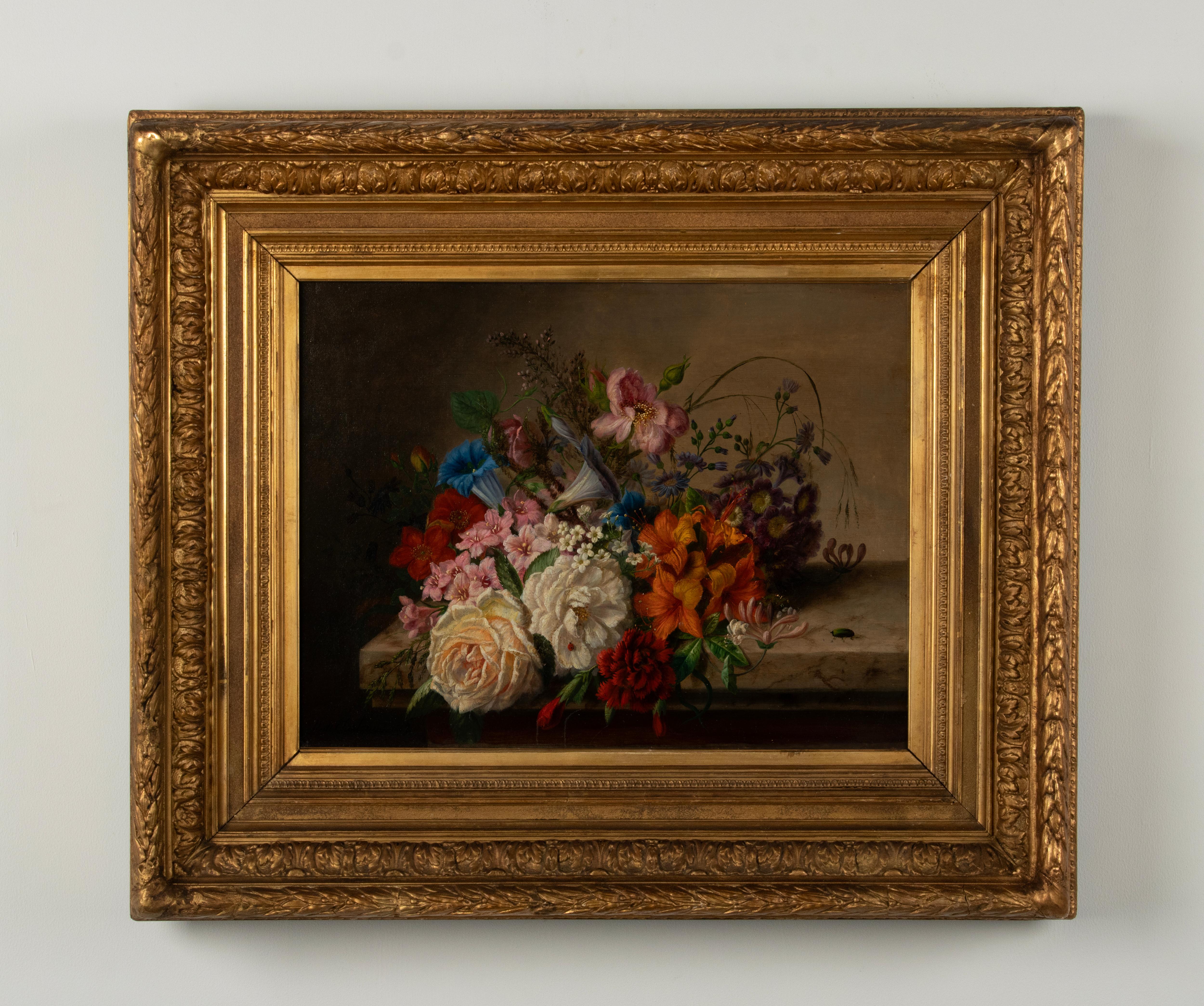 A fine quality oil painting of a flower still life in the tradition of the Dutch/Flemish Renaissance style. 
It is a beautiful antique painting. Great colorful flowers, small insects, painted with a lifelike finesse.
The painting is framed in a