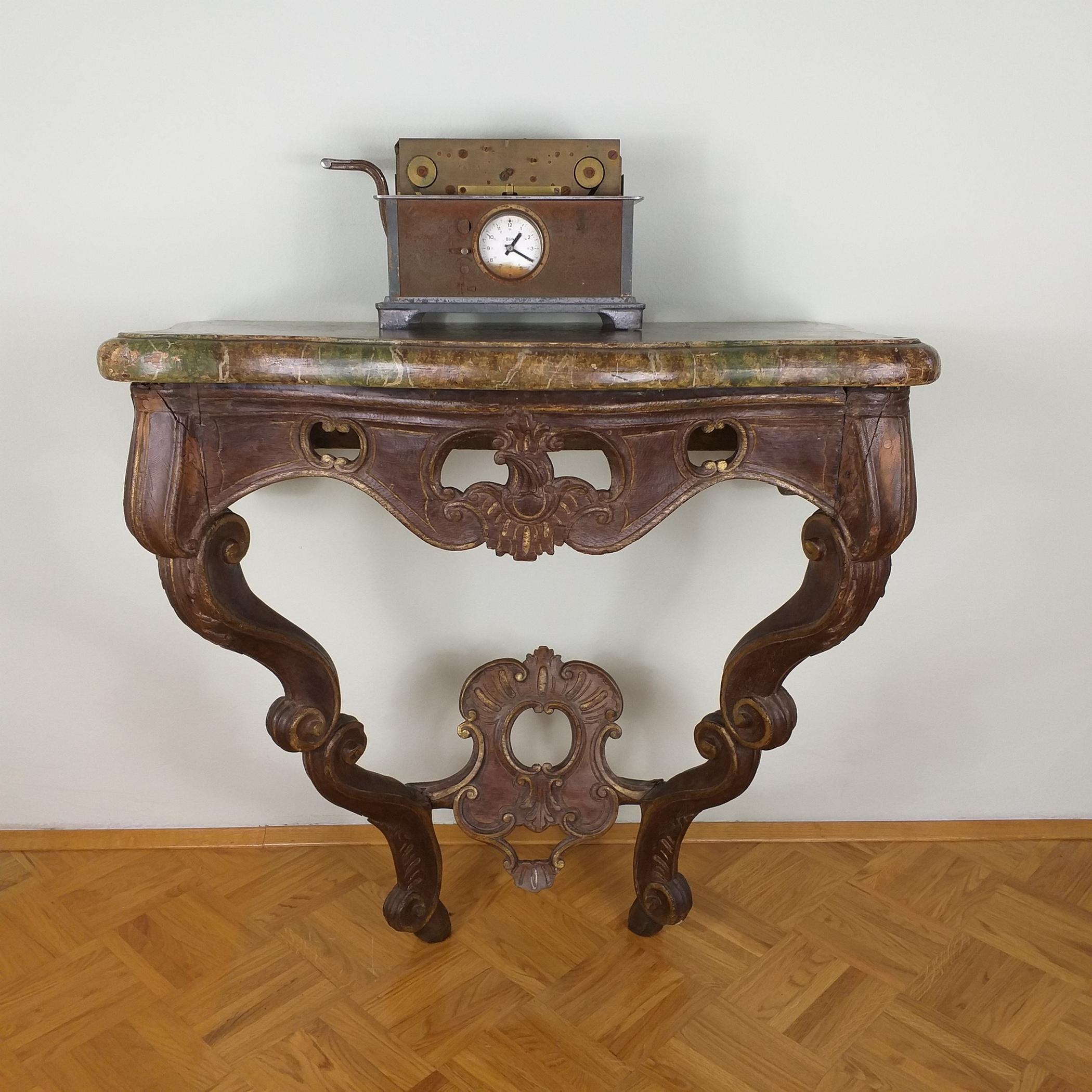 Experience the grandeur of the past with this exquisite old church console, carefully transported from a historic German church. Crafted in the midst of the 19th century, this console is a testament to the artistry of the era.

 Carved from an array