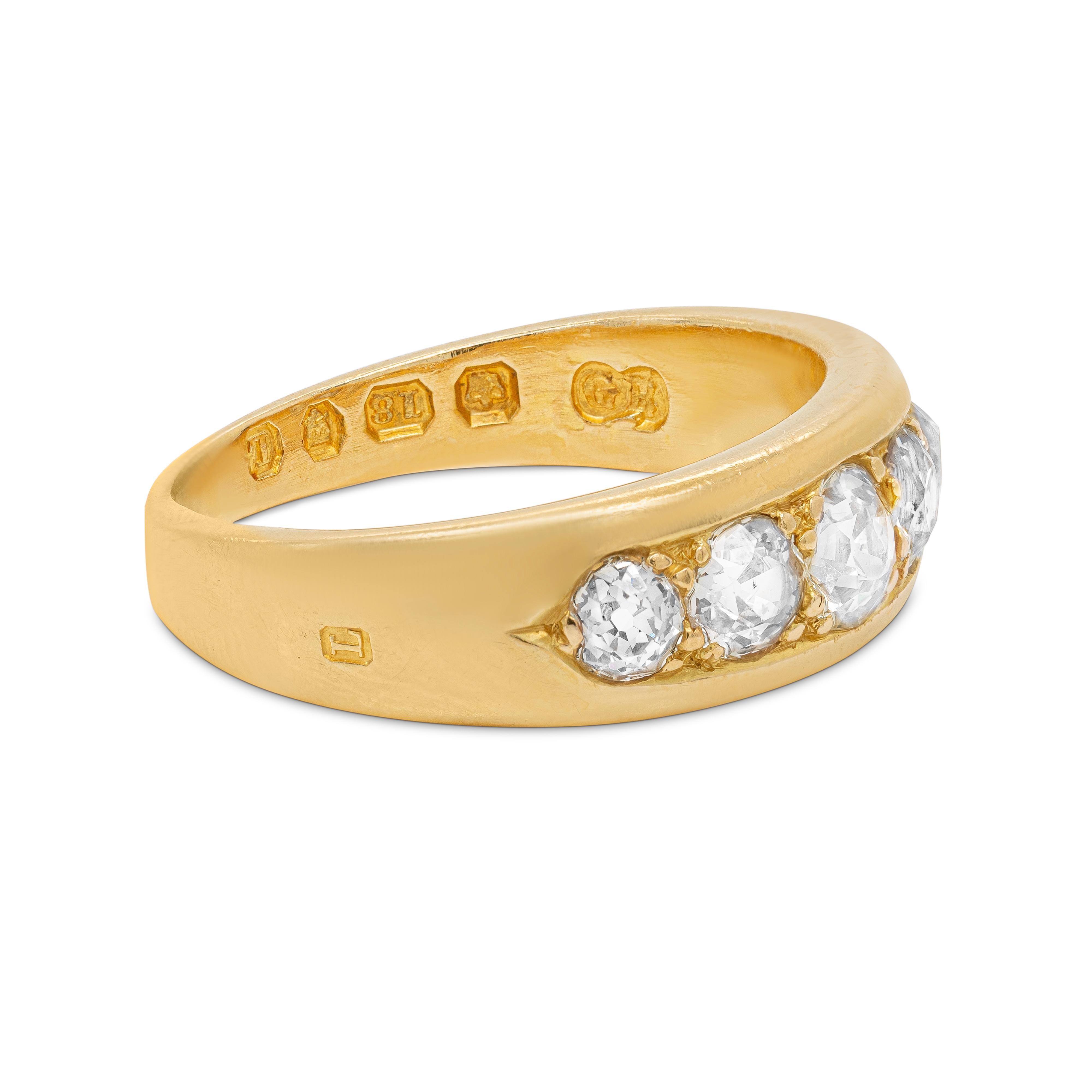 This wonderful antique Victorian ring is beautifully set with five old mine cut diamonds, weighing approximately 1.10ct combined, all grain set in 18 carat yellow gold open back settings. This beautiful piece weighs 7.04 grams, measures 6.88mm in
