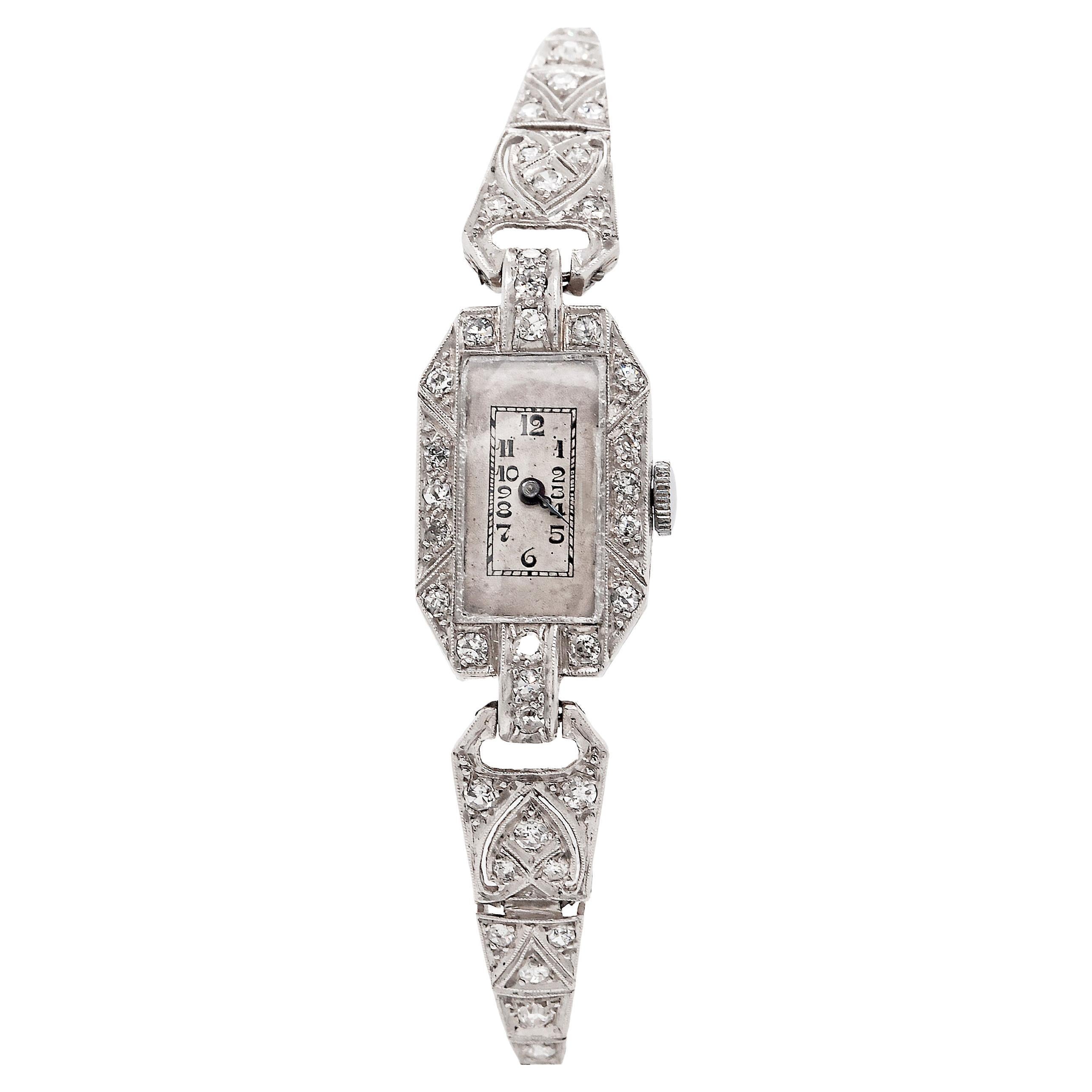 Boasting an impressive and dazzling diamond studded design, expertly crafted in precious platinum, this exquisite Art Deco ladies watch is the perfect timeless accessory for any special occasion.

Taking centre stage is a delicate 7 x 15mm