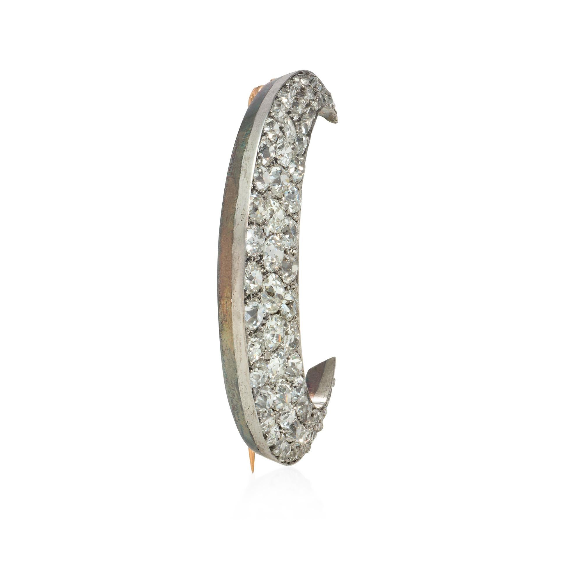An antique Victorian period diamond crescent brooch comprised of single-cut and old European-cut diamonds, in 18k gold and silver.  Atw diamonds 7.00 cts.

* Includes Kentshire's letter of authenticity for insurance purposes
* Free shipping
* Please
