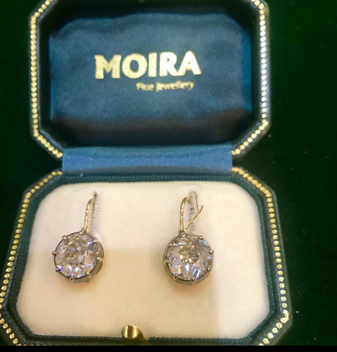 A pair of antique diamond drop earrings, set with old-cut diamonds, with a total weight of 6.64ct, in silver-upon-gold, cut down settings, with gold gallery work, on hooks, accompanied by GIA certificates. Mounts circa 1890, with new hooks.
3.51ct J